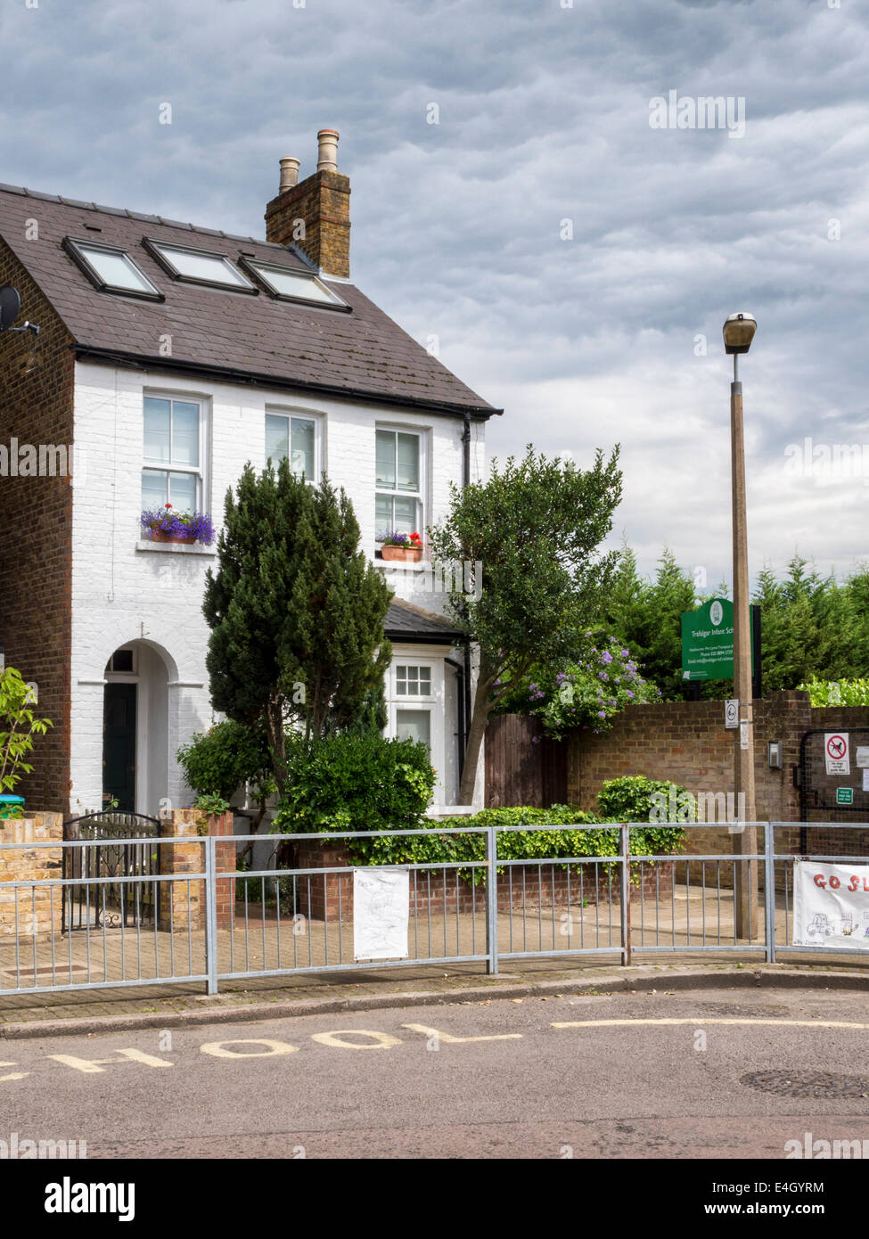 White Victorian Cottage With Loft Conversion And Tiled Roof In