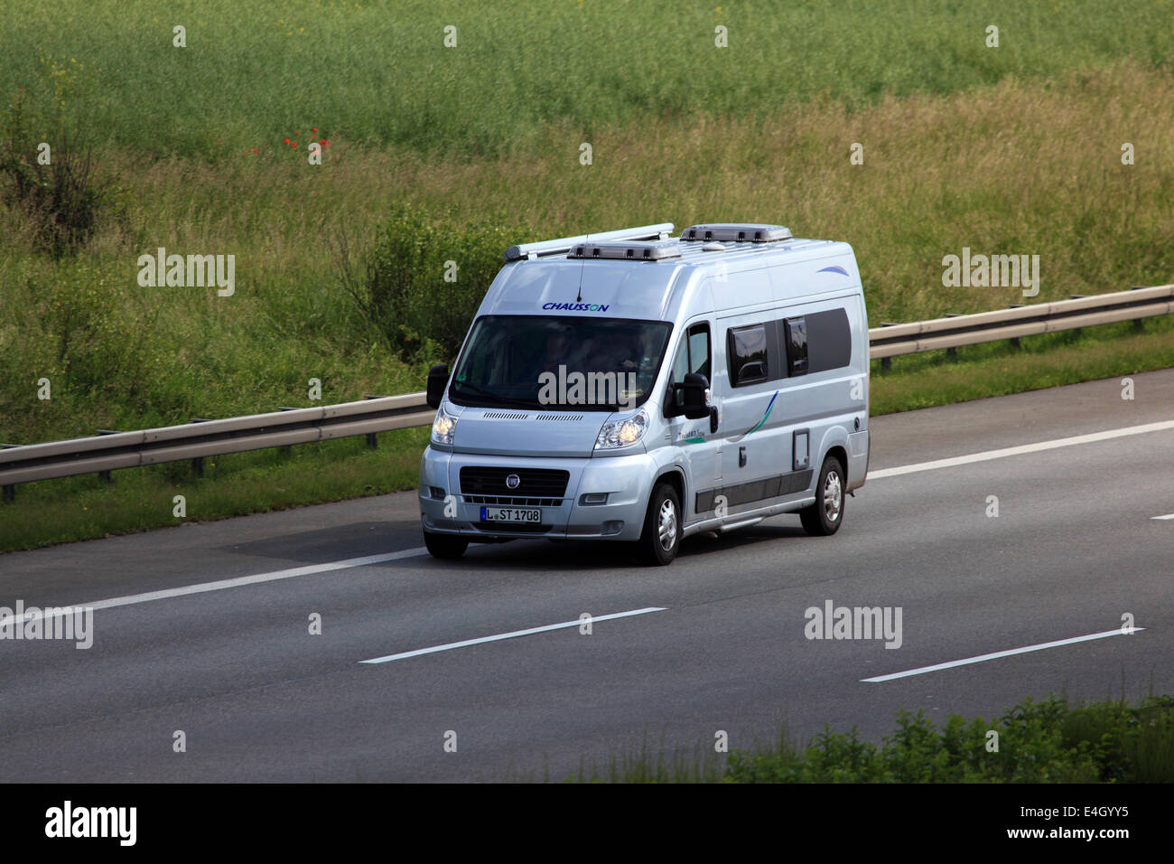 Small motor home on the highway in Germany Stock Photo