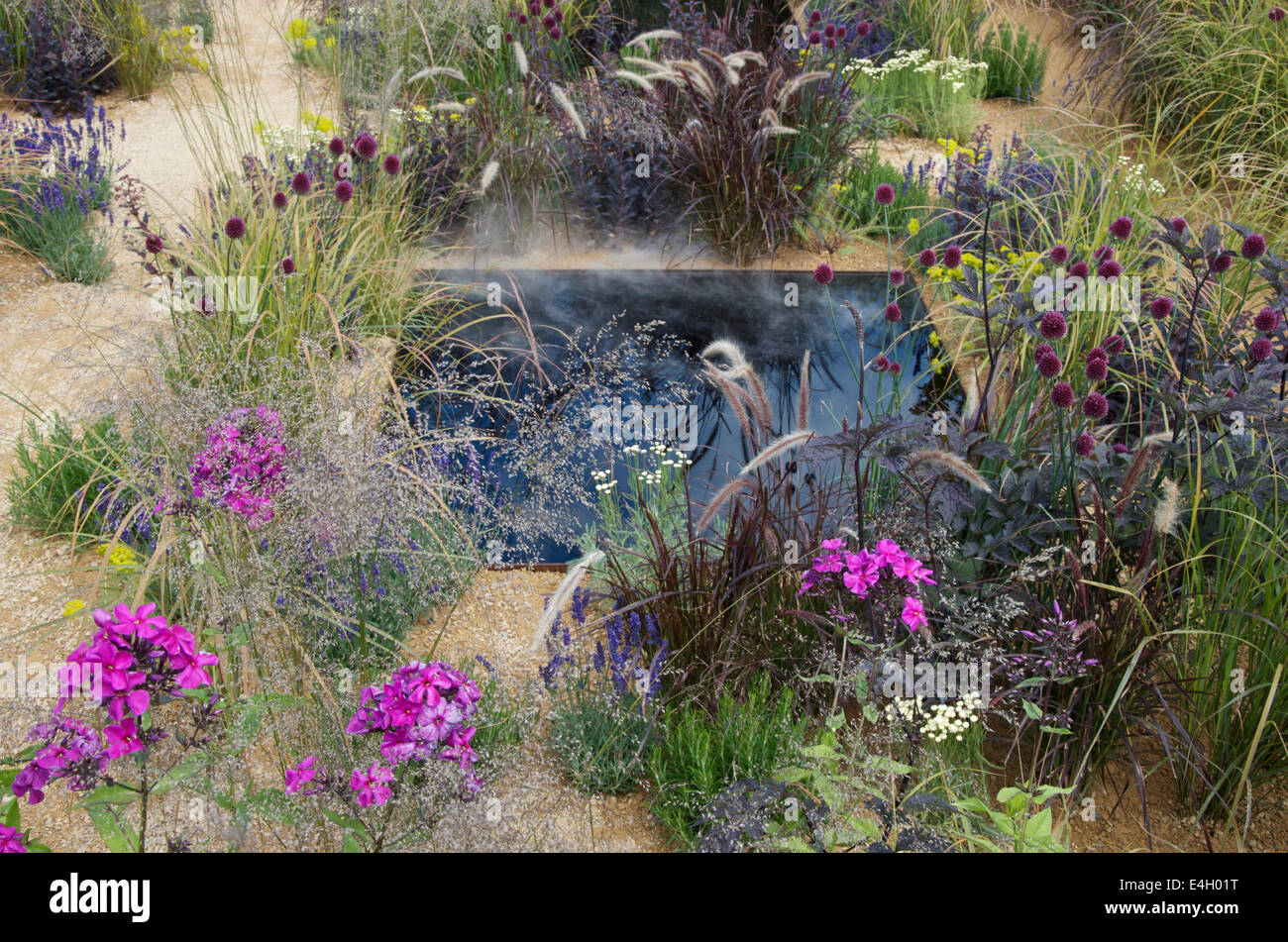 Steam rising in The One Show Garden at RHS Hampton Court palace Flower Show 2014 Stock Photo