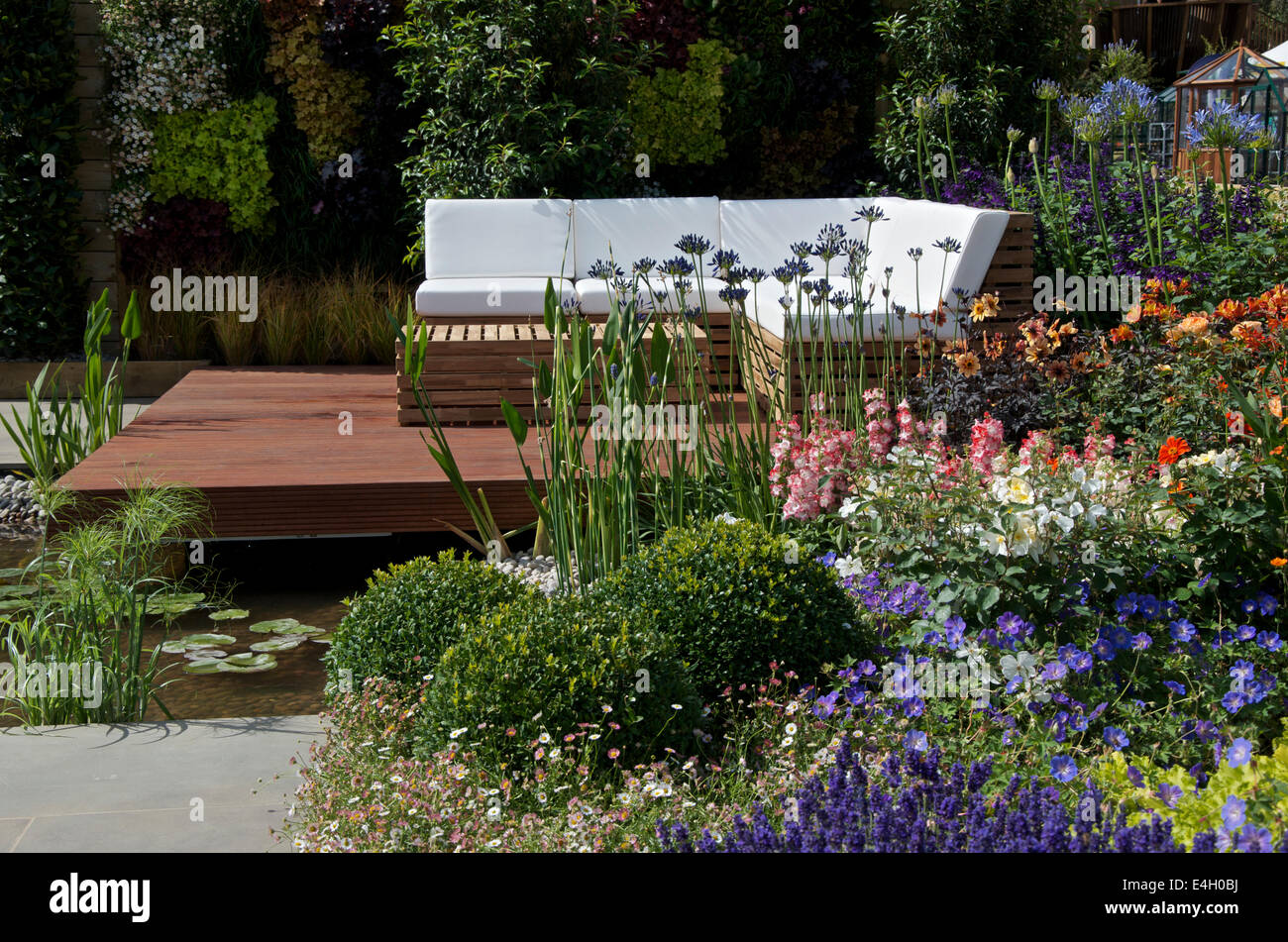 Seating area in A Hampton Garden at RHS Hampton Court Palace Flower Show 2014. Stock Photo