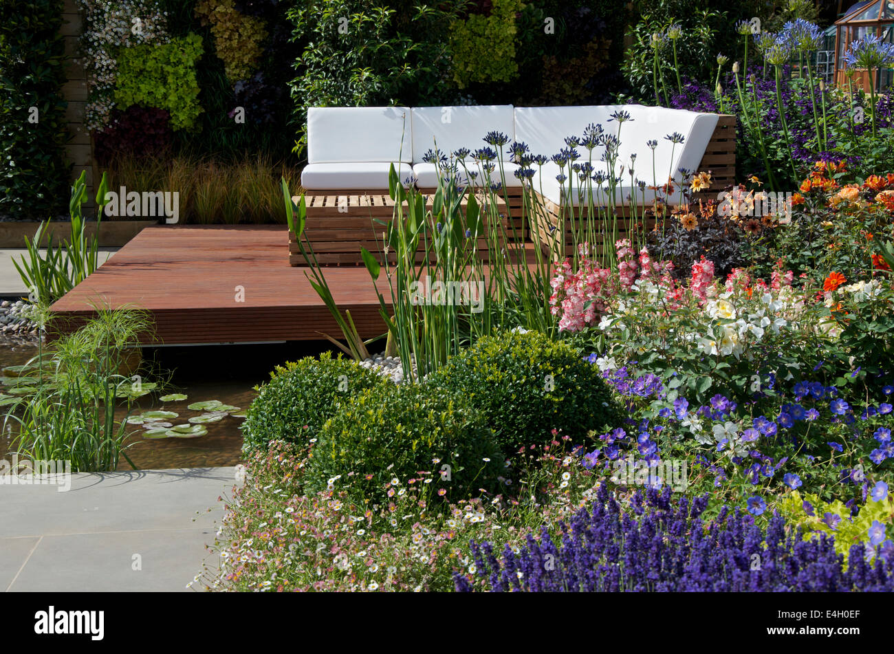 Seating area in A Hampton Garden at RHS Hampton Court Palace Flower Show 2014. Stock Photo