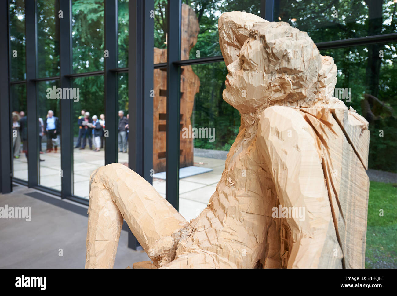 The wooden sculpture 'Satyr' by Stephan Balkenhol in the sculpture park in Wuppertal, Germany, 11 July 2014. Balkenhols' important works, who is a professor at the Karslruhe Art Academy, are on display until 12 October. Photo: BERND THISSEN/dpa Stock Photo