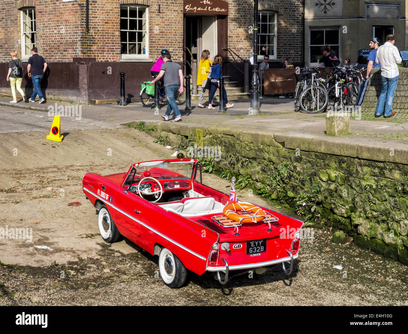 Amphicar - red amphibious car -  German vehicle designed by Hans Trippel parked at riverside, Richmond upon Thames, London Stock Photo
