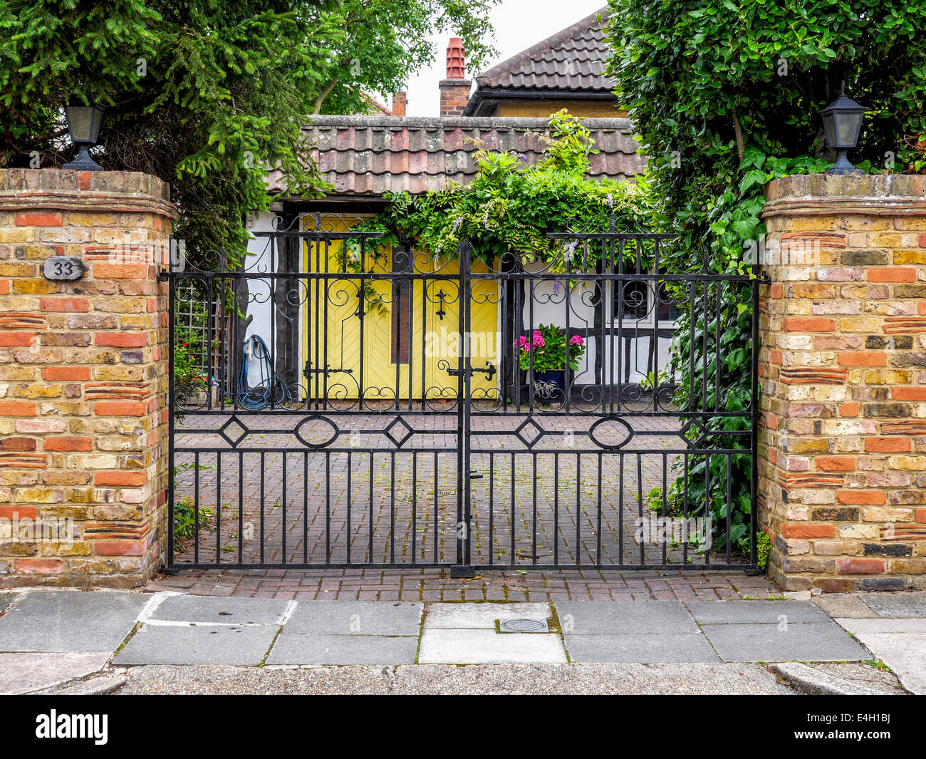 Decorative wrought iron gate and brick wall of Twickenham house
