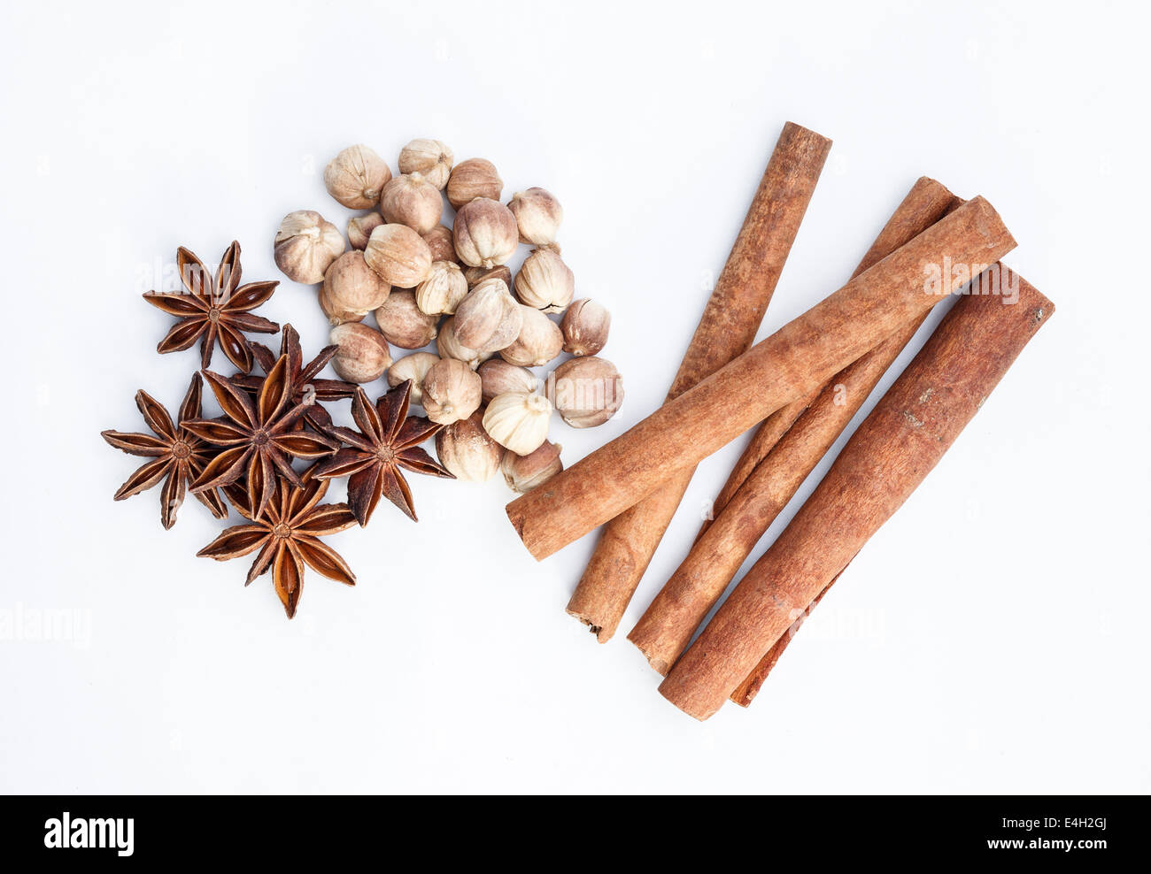 Cardamom cinnamon and star aniseed herbs for cooking isolated on white