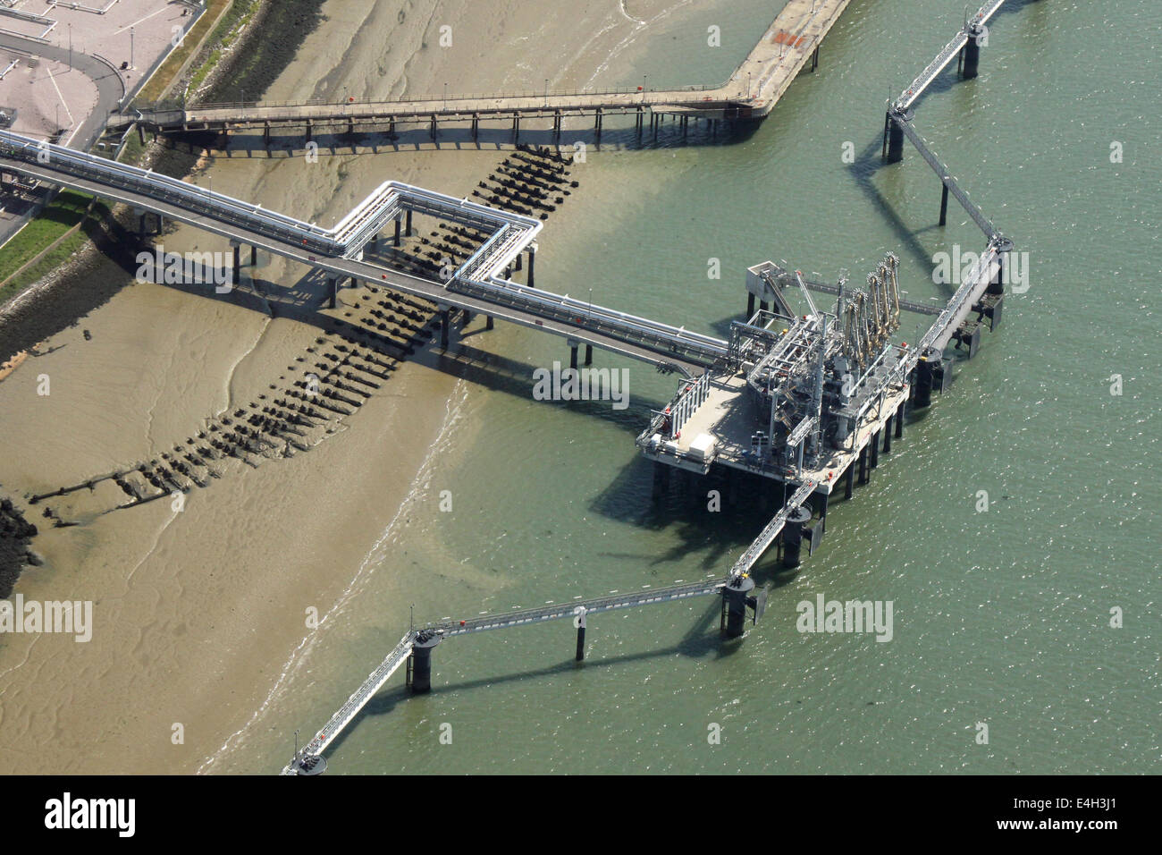 aerial view of a chemical works jetty in the River Medway, Isle of Grain, UK Stock Photo