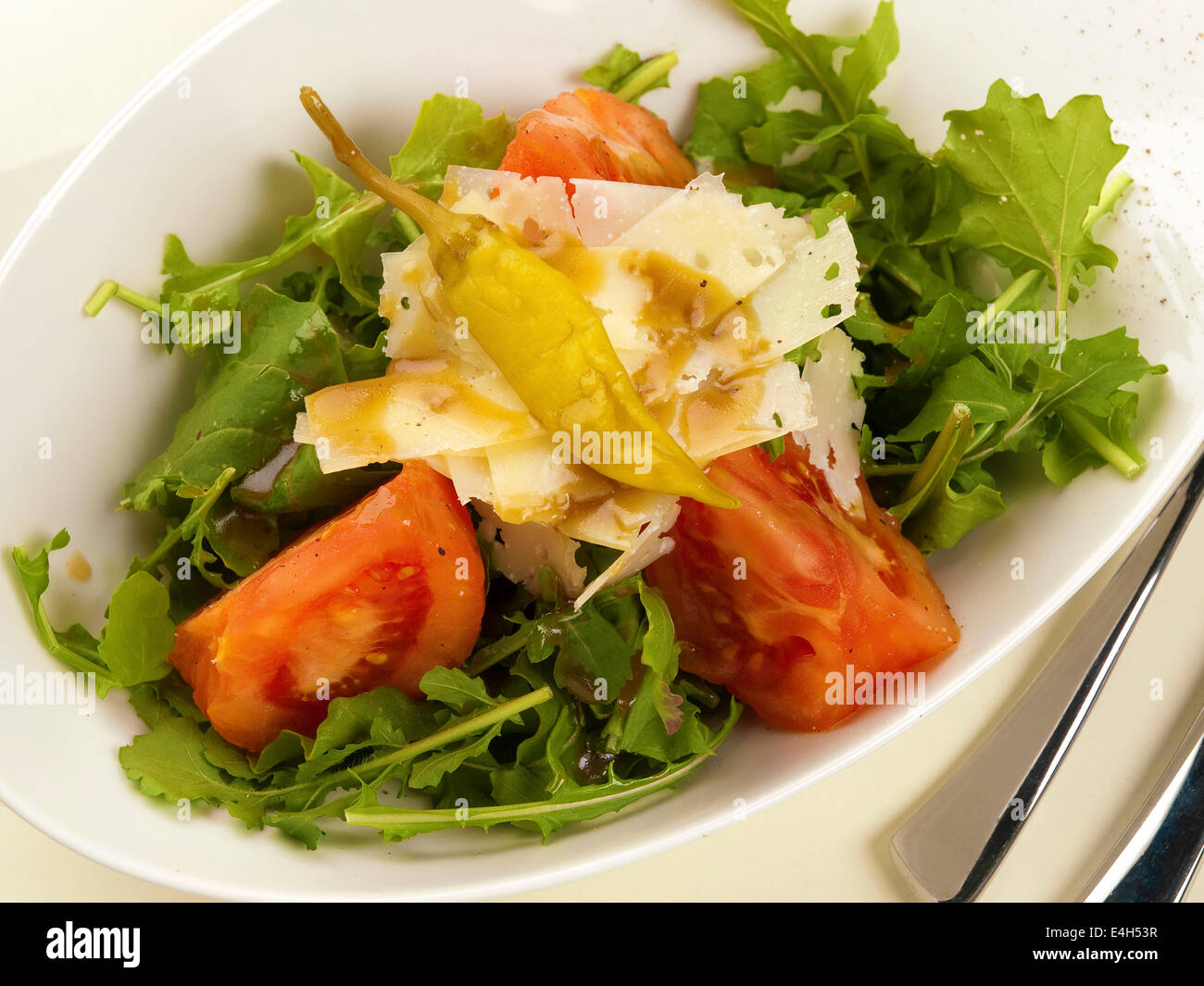 Rocket salad with tomato and Parmesan Stock Photo