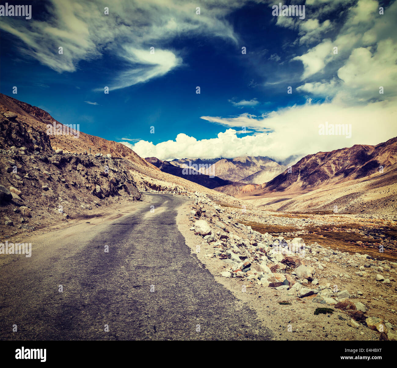 Vintage retro effect filtered hipster style travel image of Scenic road in Himalayas near Khardung-La pass. Ladakh, India Stock Photo