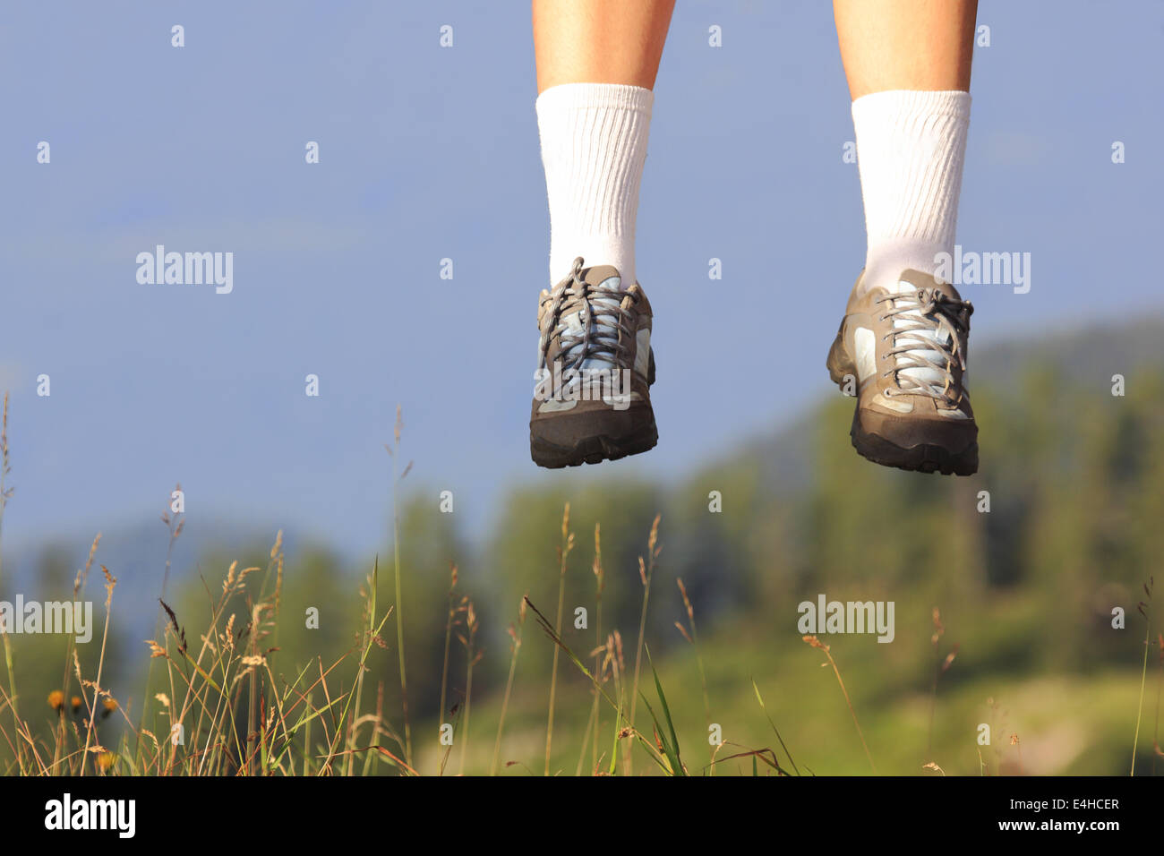 Jumping with sport shoes in summer season Stock Photo - Alamy