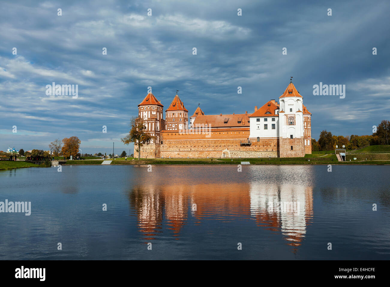 Travel belarus background - Medieval Mir castle famous landmark in town Mir, Belarus reflecting in lake Stock Photo