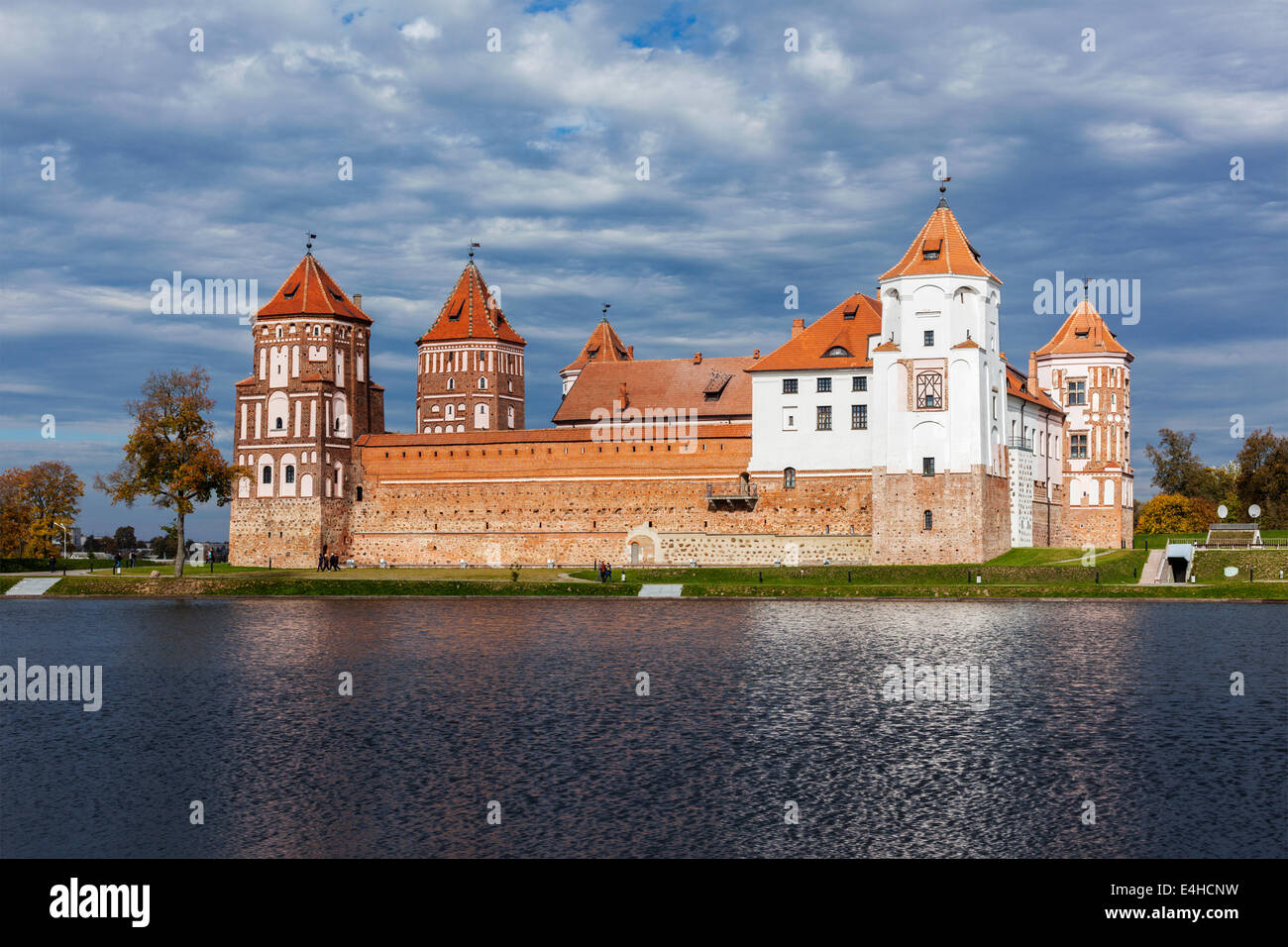 Travel belarus background - Medieval Mir castle famous landmark in town Mir, Belarus reflecting in lake Stock Photo