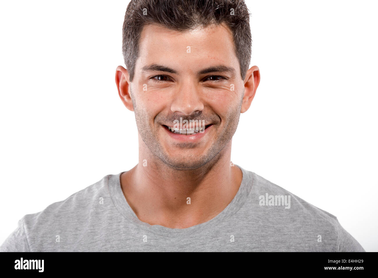 Portrait of a handsome latin man smiling, isolated over a white background Stock Photo