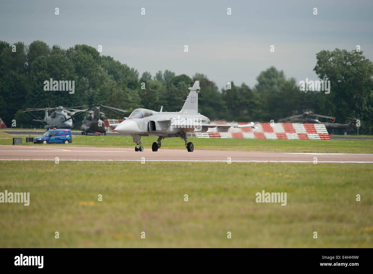 RAF Fairford, Gloucestershire UK. 11th July 2014. Fast jets on display at the first day of RIAT. Swedish Air Force JAS 39C Gripen awaits clearance for take-off on the runway. Credit:  Malcolm Park editorial/Alamy Live News Stock Photo
