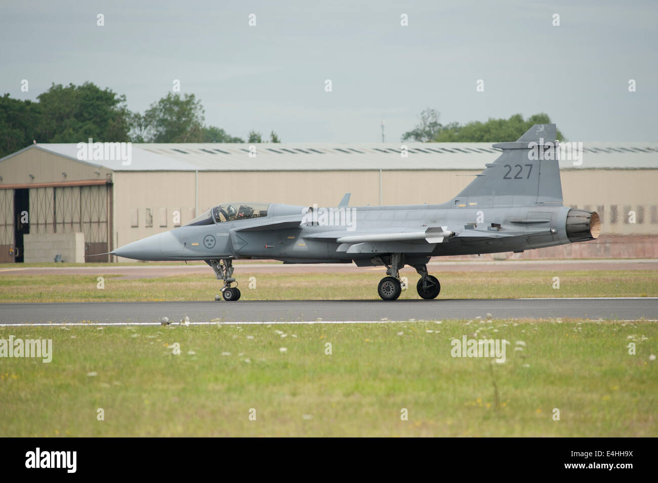 RAF Fairford, Gloucestershire UK. 11th July 2014. Fast jets on display at the first day of RIAT. Swedish Air Force Saab JAS 39C Gripen thunders down the runway at take-off. Credit:  Malcolm Park editorial/Alamy Live News Stock Photo