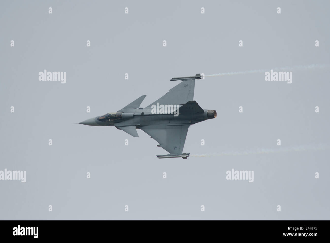 RAF Fairford, Gloucestershire UK. 11th July 2014. Fast jets on display at the first day of RIAT. Swedish Air Force Saab JAS 39C Gripen makes a high speed fly-past. Credit:  Malcolm Park editorial/Alamy Live News Stock Photo
