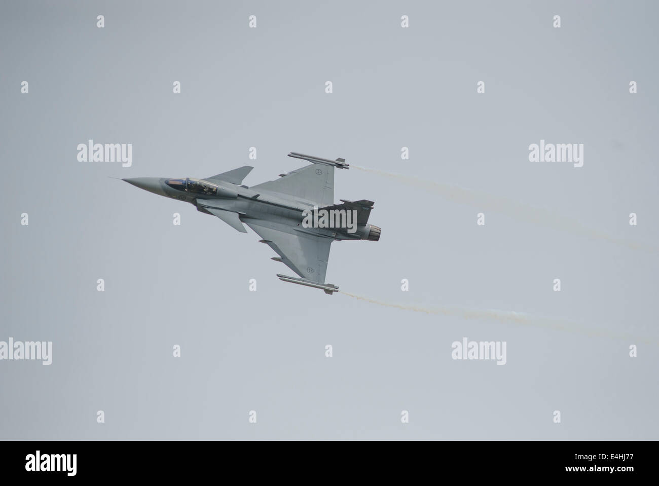 RAF Fairford, Gloucestershire UK. 11th July 2014. Fast jets on display at the first day of RIAT. Swedish Air Force Saab JAS 39C Gripen makes a fly-past. Credit:  Malcolm Park editorial/Alamy Live News Stock Photo