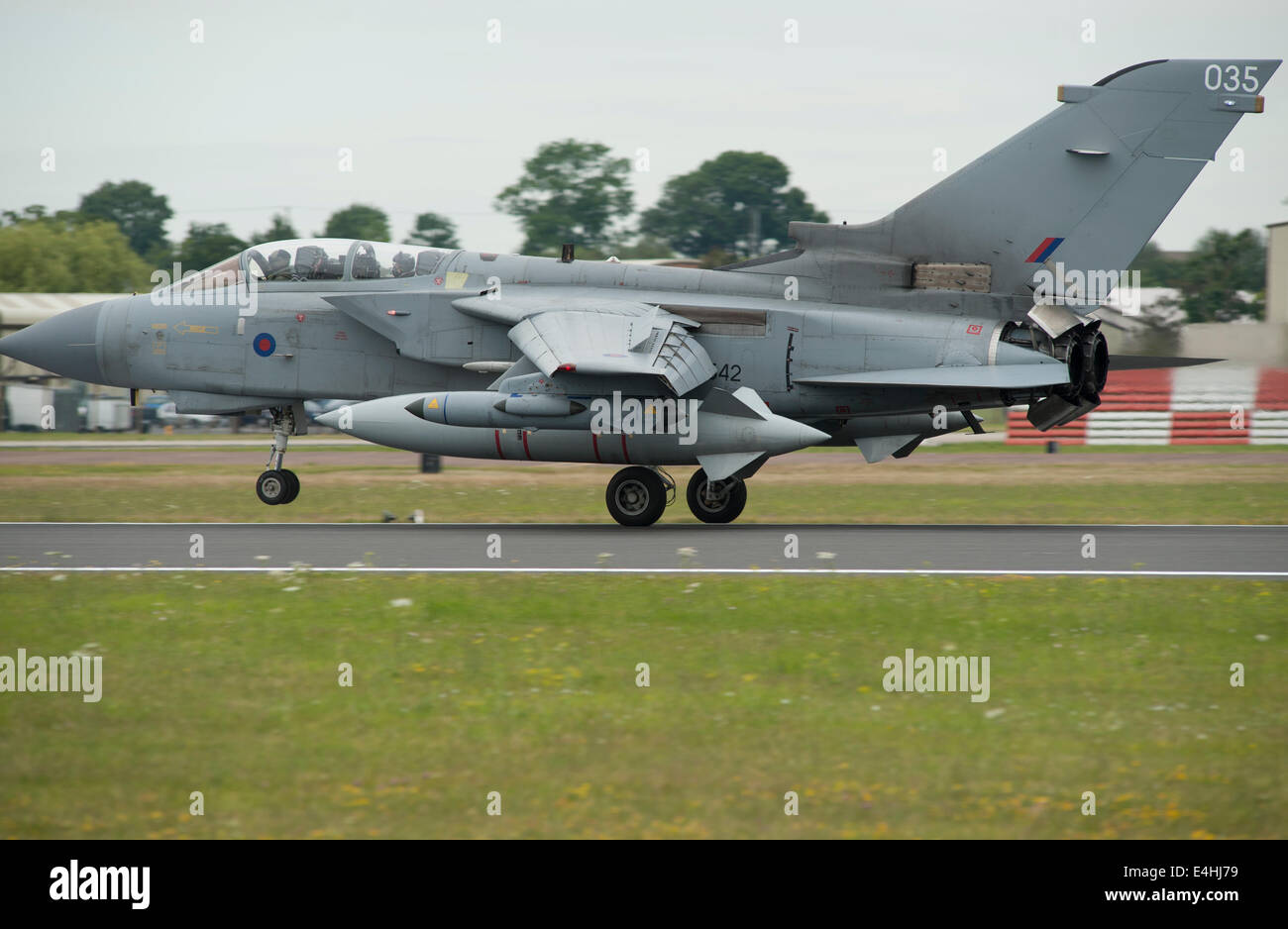 RAF Fairford, Gloucestershire UK. 11th July 2014. Fast jets on display at the first day of RIAT. Royal Air Force Panavia Tornado GR4 lands. Credit:  Malcolm Park editorial/Alamy Live News Stock Photo