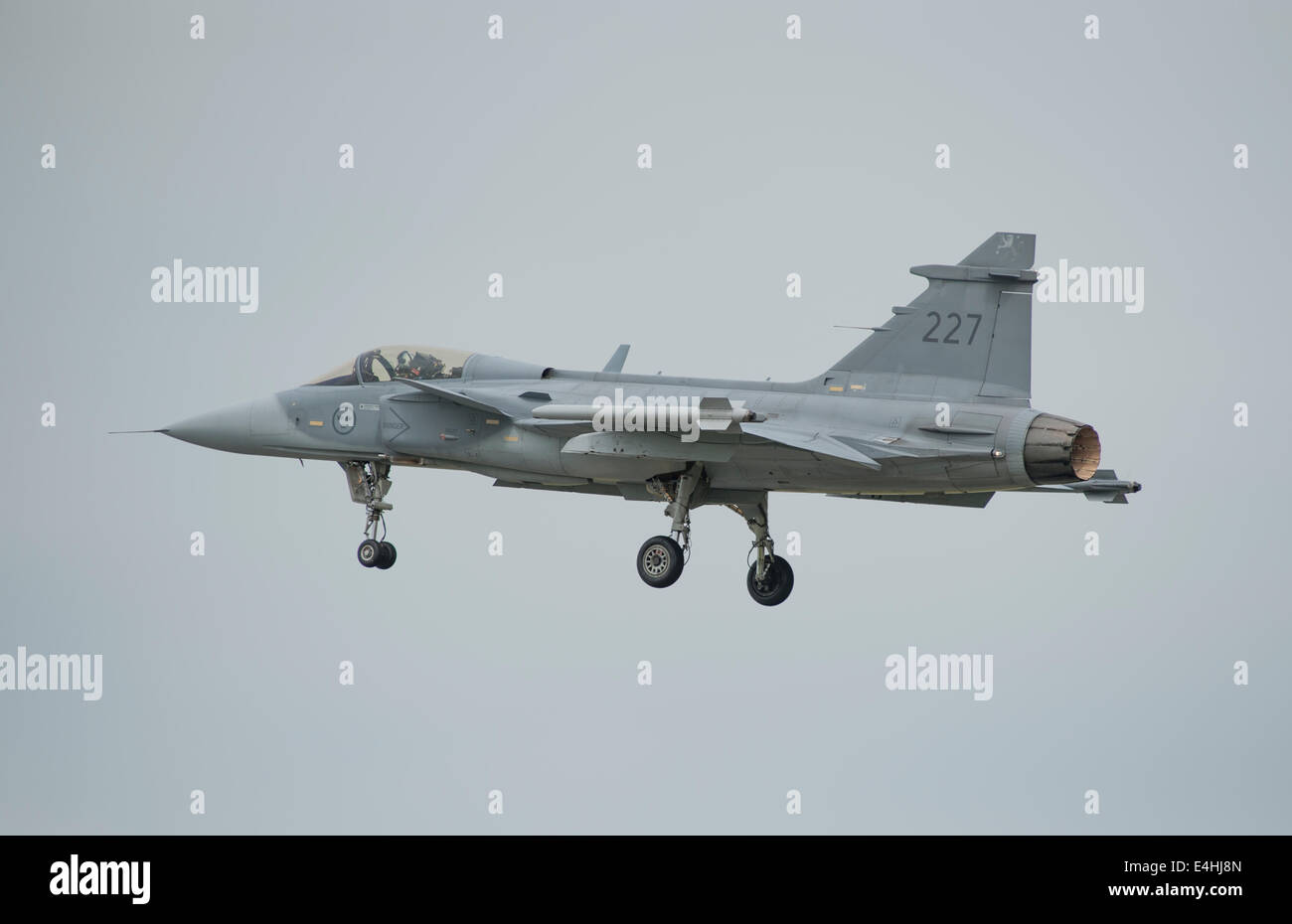 RAF Fairford, Gloucestershire UK. 11th July 2014. Fast jets on display at the first day of RIAT. Swedish Air Force Saab JAS 39C Gripen makes a low speed fly-past with undercarriage down. Credit:  Malcolm Park editorial/Alamy Live News Stock Photo
