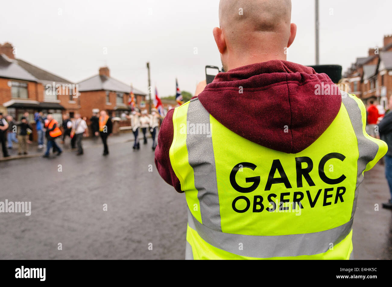 Belfast, Northern Ireland. 12 Jul 2014 - Dee Fennell from GARC records the Orange parade using a mobile phone. Credit:  Stephen Barnes/Alamy Live News Stock Photo
