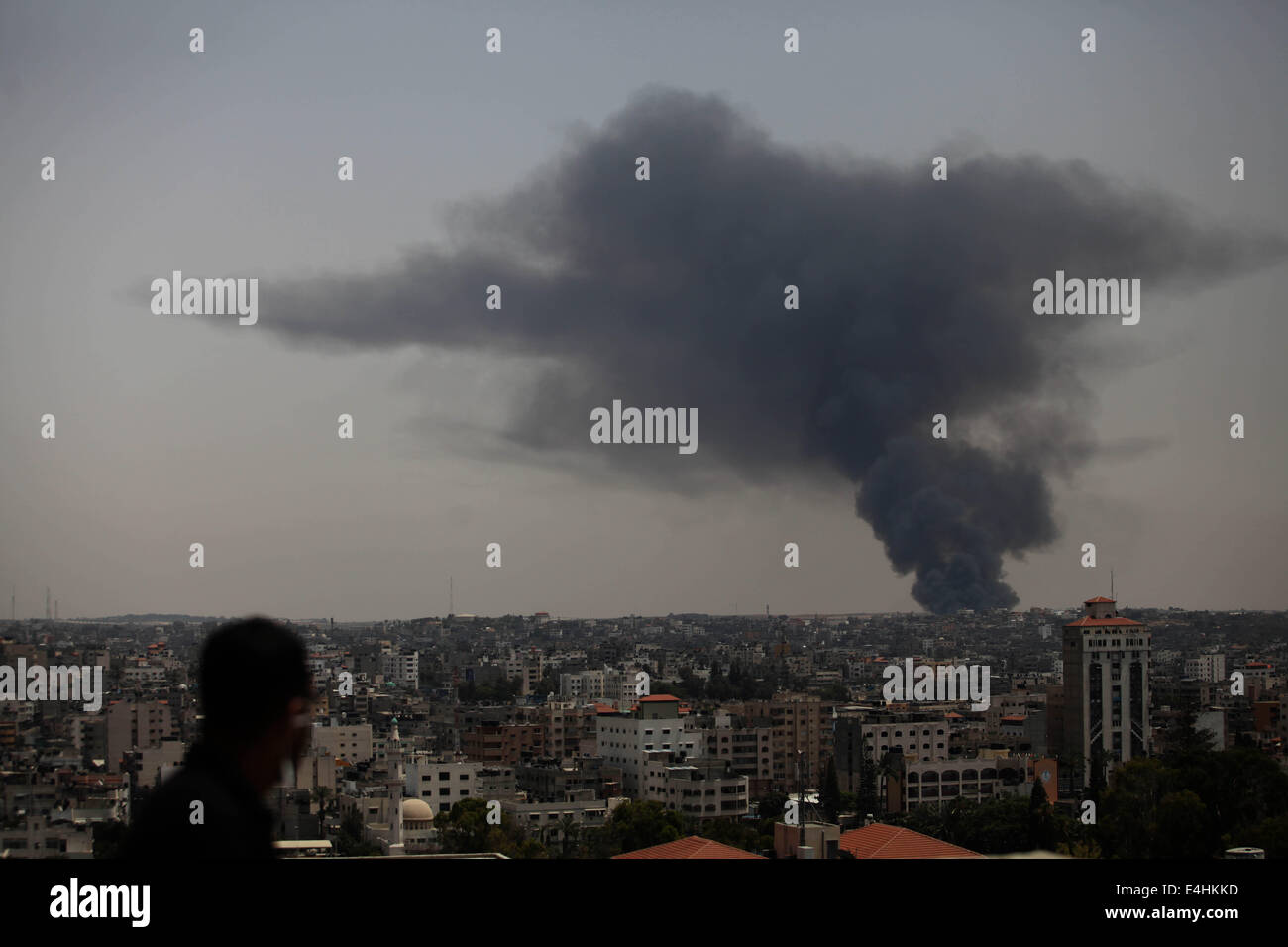 Gaza, Palestinian Territory. 12th July, 2014.  Smoke rises following an Israeli strike on Gaza, seen from the Israel-Gaza border, Saturday, July 12, 2014. Israeli airstrikes targeting Hamas in Gaza hit a mosque its military says concealed the militant group's weapons, in an offensive that showed no signs of slowing down. Israel launched its campaign five days ago to stop relentless rocket fire on its citizens. While there have been no fatalities in Israel, Palestinian officials said overnight attacks raised the death toll there to over 120, with more than 920 wounded. (Credit Imag Stock Photo