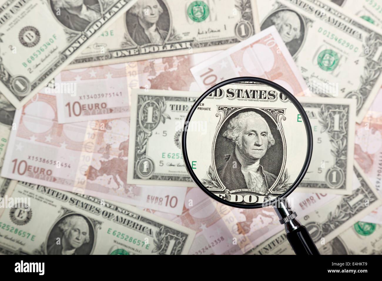 Focusing on US dollar note against US and Euro currencies background Stock Photo