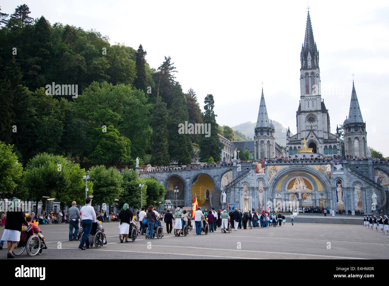 people are praying in Lourdes Stock Photo - Alamy