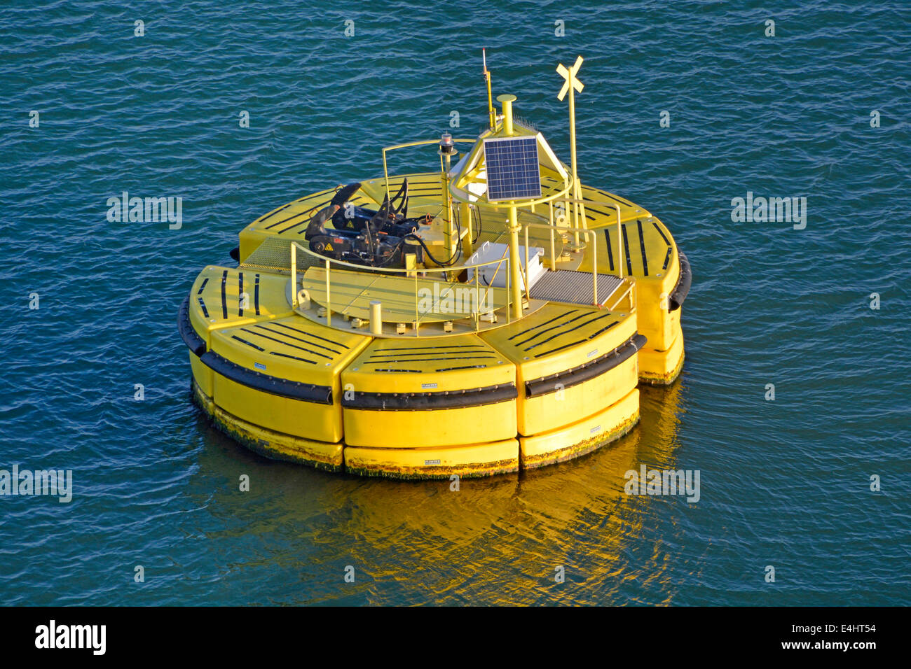 Solar panel on Floatex business floating anchor buoy anchored to sea bed for securing mooring ropes of shipping using quick release hawser hooks EU Stock Photo