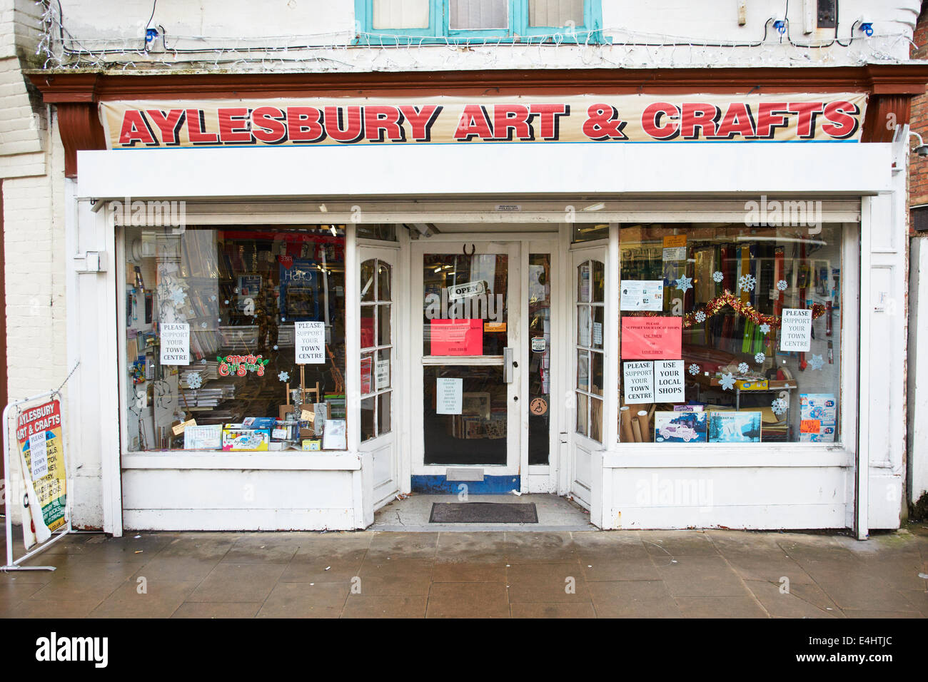 Signs asking for support for local shops in the window of the Aylesbury
