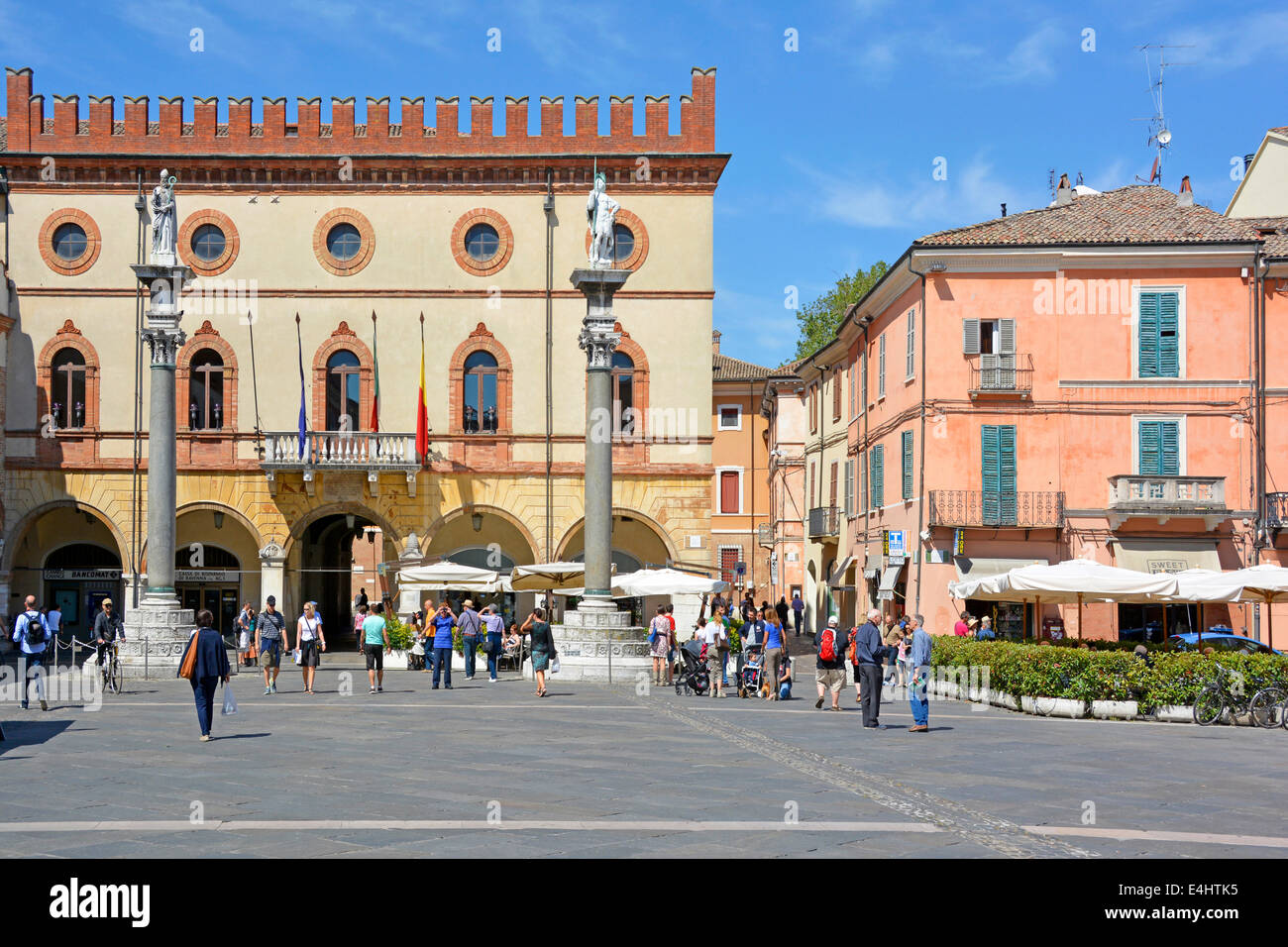 Piazza del Popolo Ravenna buildings and statues tourists & locals in the Town Square blue sky summer sunny day in Emilia Romagna Italy Europe Stock Photo
