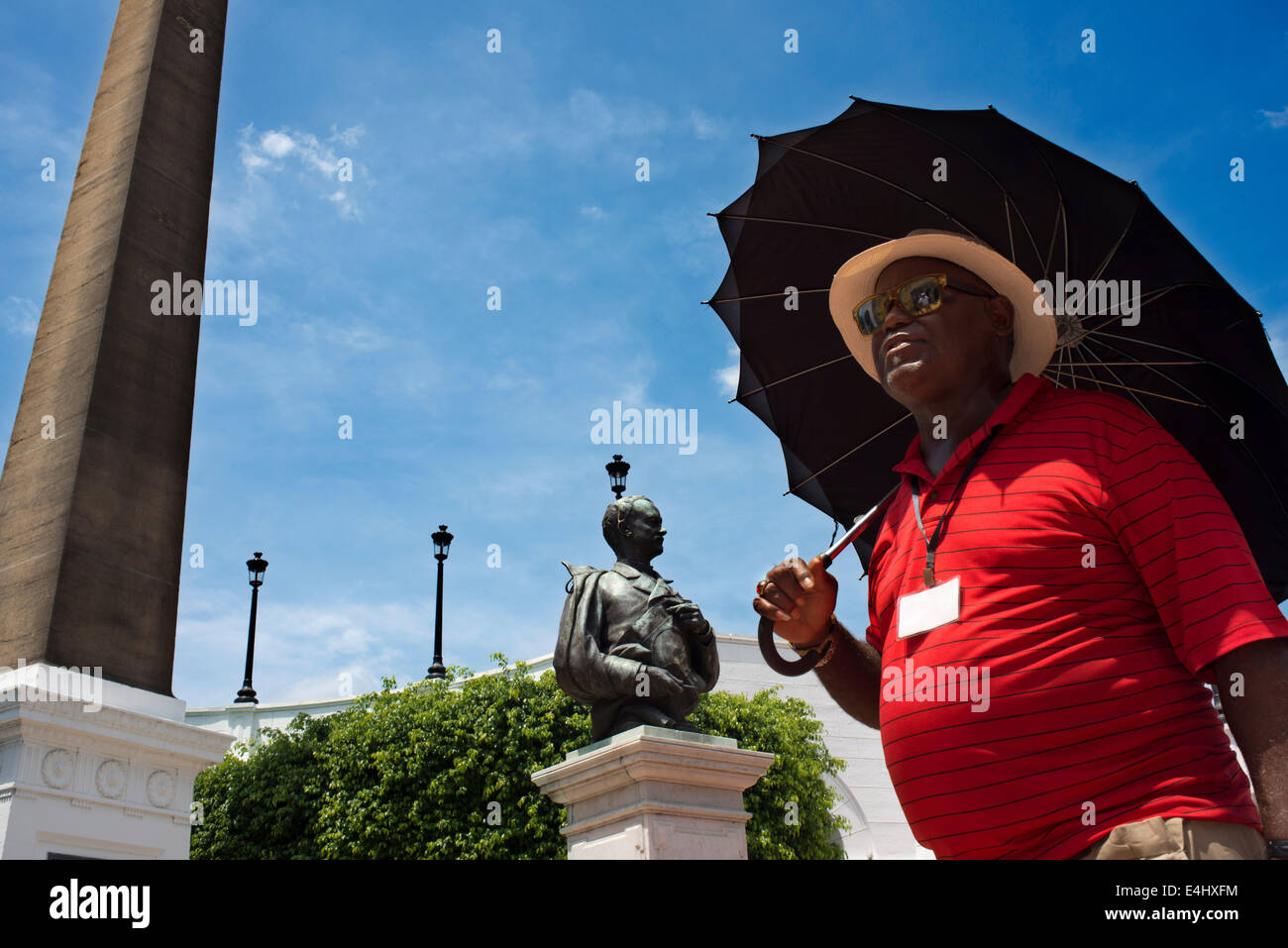 A men walking arround Obelisk with the French rooster on Plaza de Francia square in Panama City, Panama, Central America. French Stock Photo