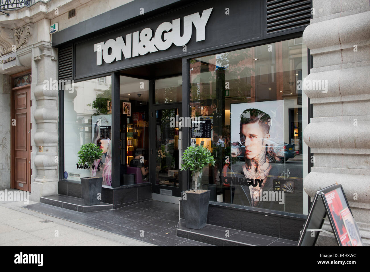The shop storefront of a branch of Toni & Guy hairdressers on Deansgate in Manchester, UK. Stock Photo