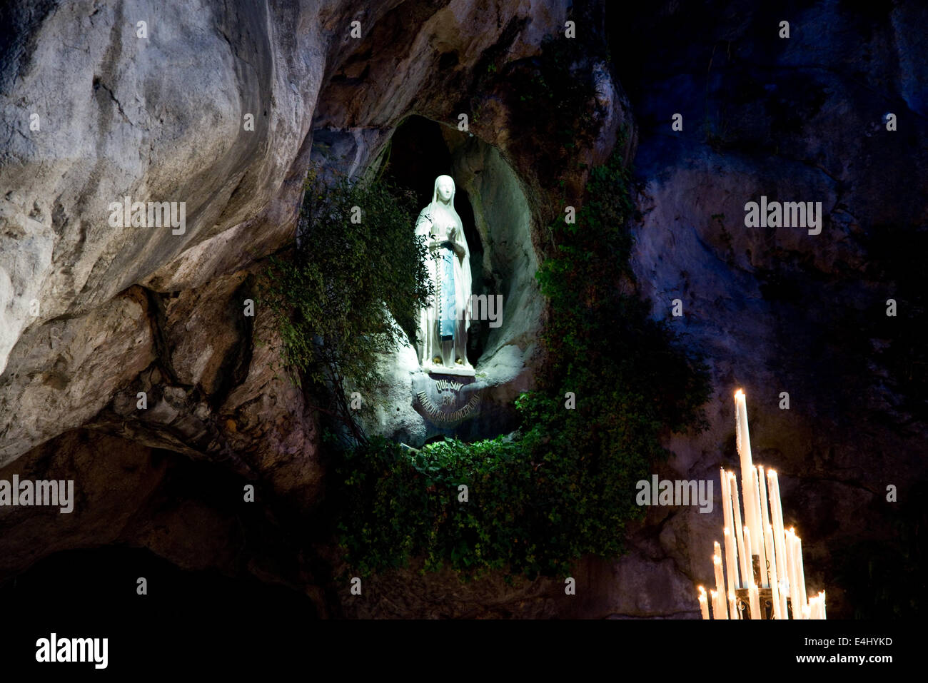 Statue of the Virgin Mary in the grotto of Lourdes Stock Photo - Alamy