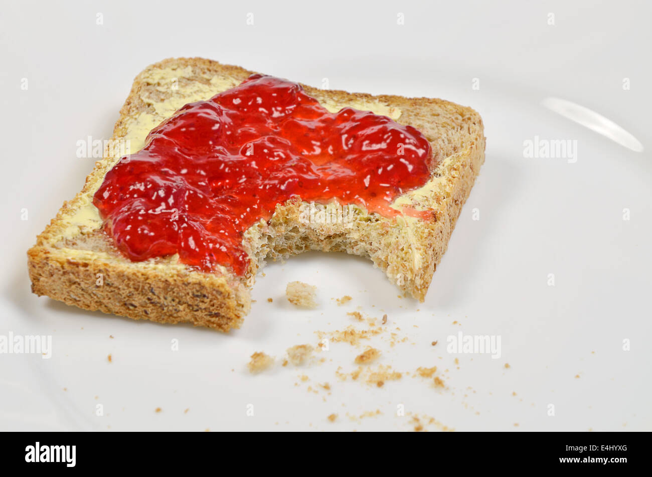 Toast Sandwich With Strawberry Jam And Butter Missing Bite On White Plate Close Up Stock Photo Alamy Toast Sandwich With Strawberry Jam And Butter Missing Bite On White Plate Close Up Stock Photo Alamy