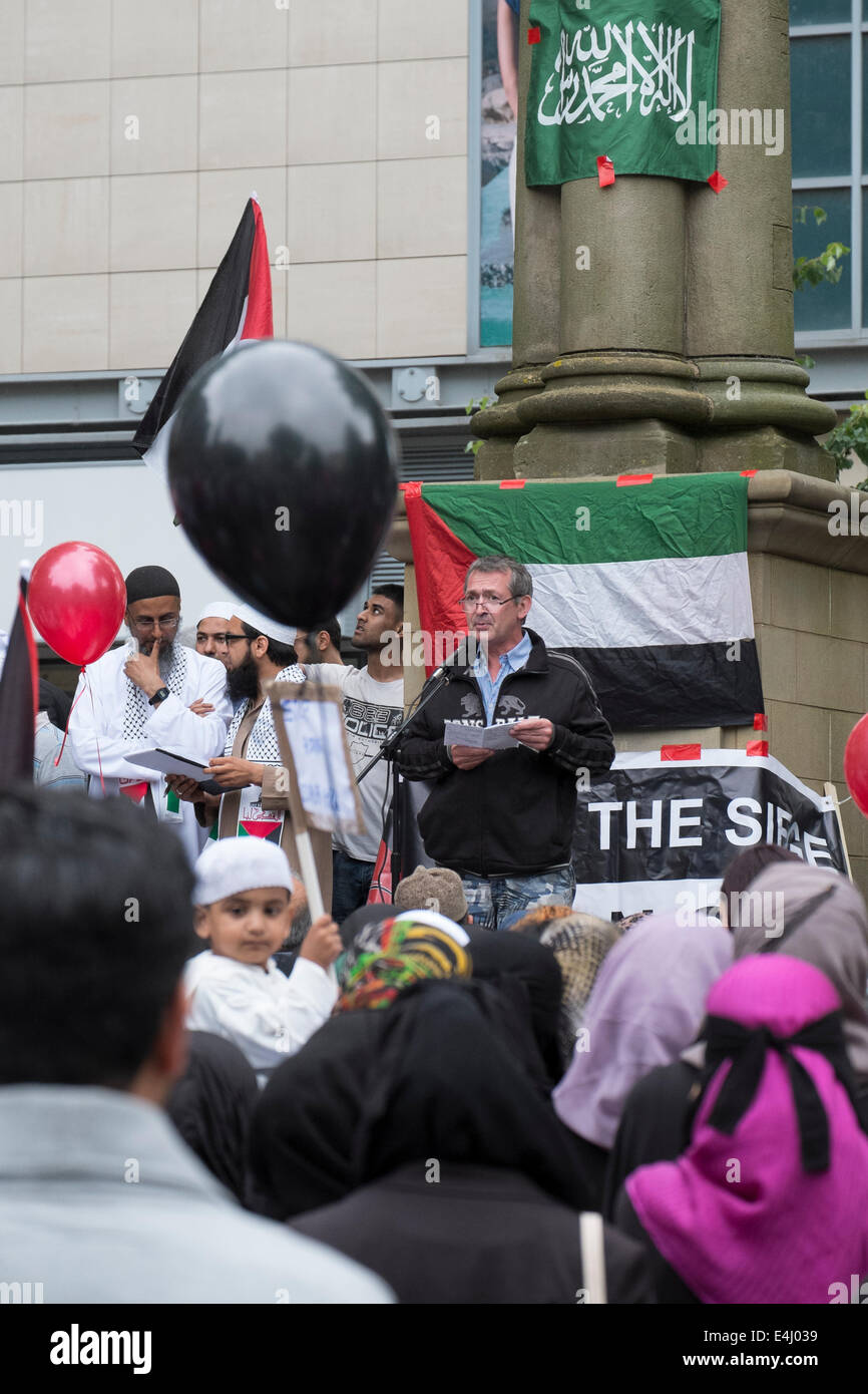 Preston, Lancashire, UK. 12th July, 2014. A peaceful protest against the ongoing military assault on Gaza has been held in Preston City Centre. The event which attracted hundreds of people to the City’s Flag Market was organised by the Preston based charity, Children of the Ghetto. The charity are calling for the international community to intervene and end the carnage and collective punishment of the Palestinian people. Credit:  Paul Melling/Alamy Live News Stock Photo