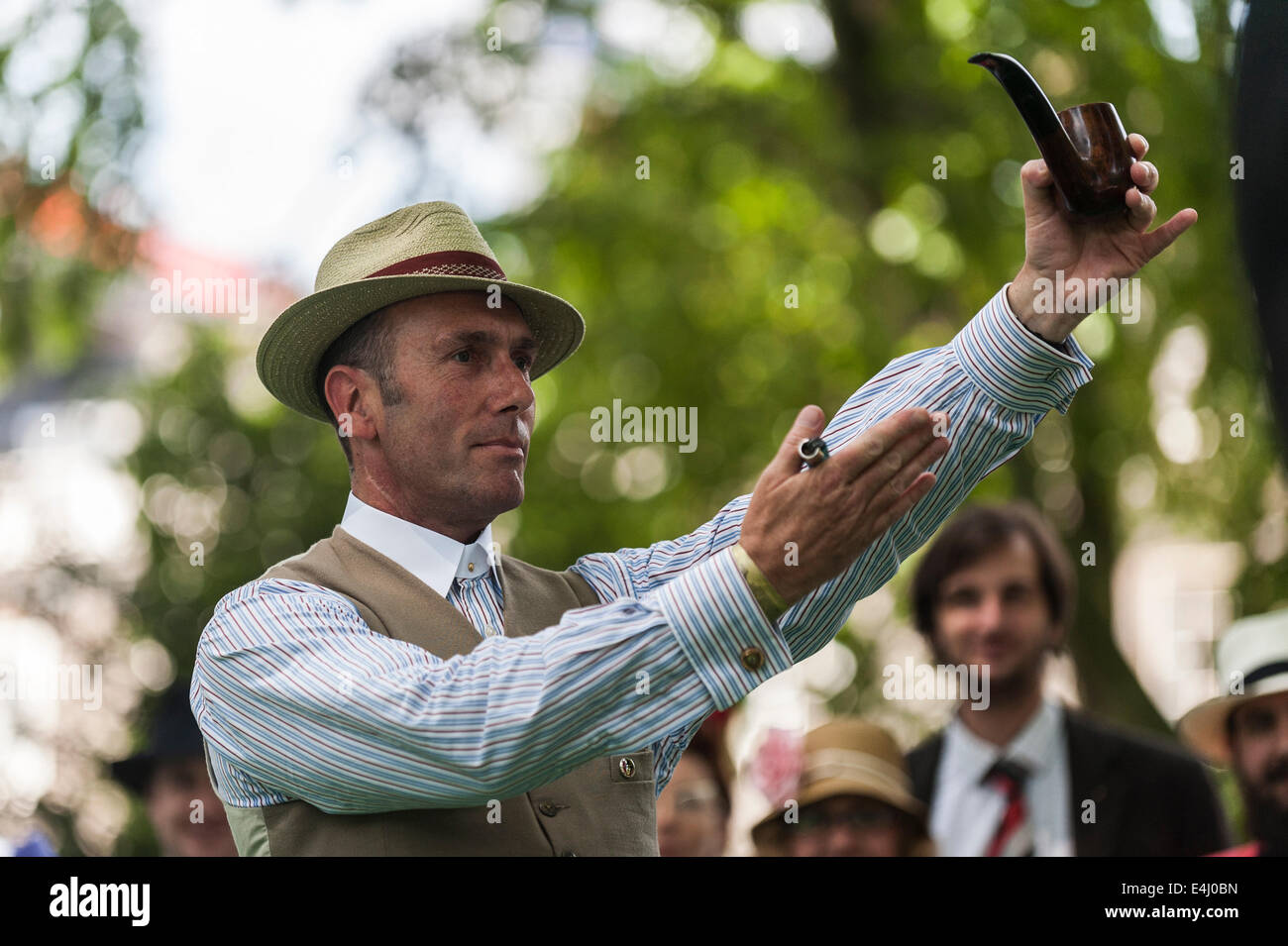 Bedford Square, Bloomsbury, London, 19th April 2014.  Gustav Temple, the editor of The Chap magazine and founder of the Chap Olympiad celebrates the opening of the games by lighting the official Chap pipe.  Photographer;  Gordon Scammell Scammell/Alamy Live News Stock Photo