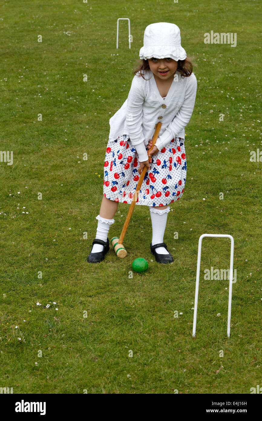 A girl playing lawn croquet Stock Photo Alamy
