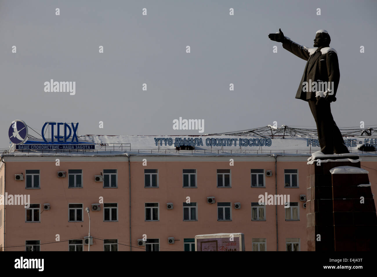 Russian town Roof Lenin statue snow Buildings Stock Photo