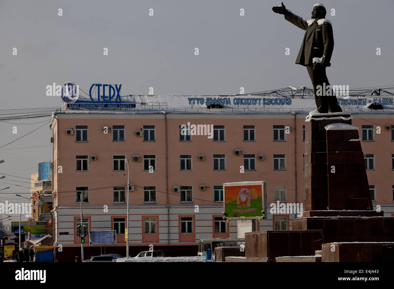 Russian town street Lenin statue snow Buildings Stock Photo