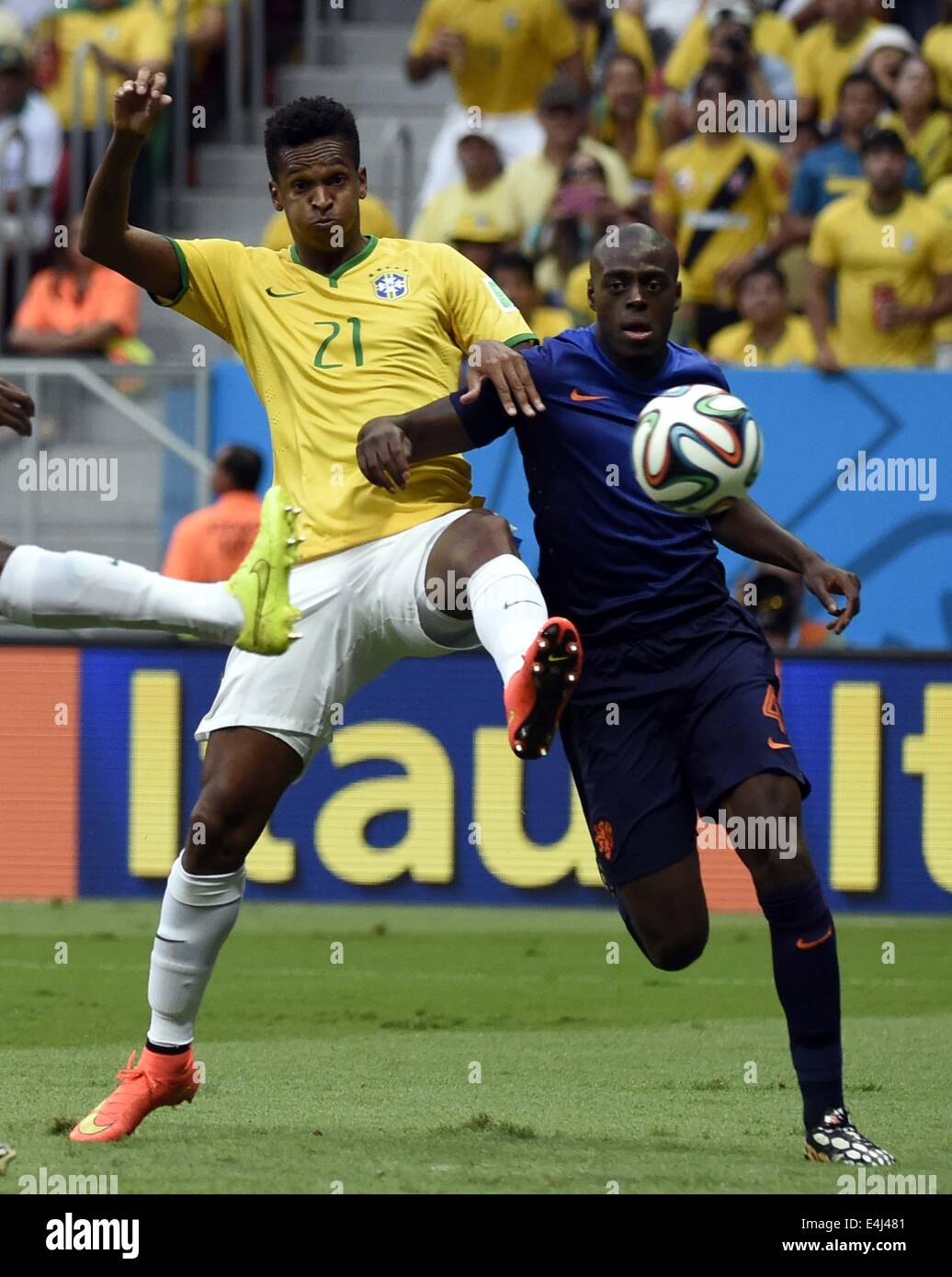 Brasilia, Brazil. 12th July, 2014. Netherlands' Bruno Martins Indi vies  with Brazil's Jo during the third place play-off match between Brazil and  Netherlands of 2014 FIFA World Cup at the Estadio Nacional