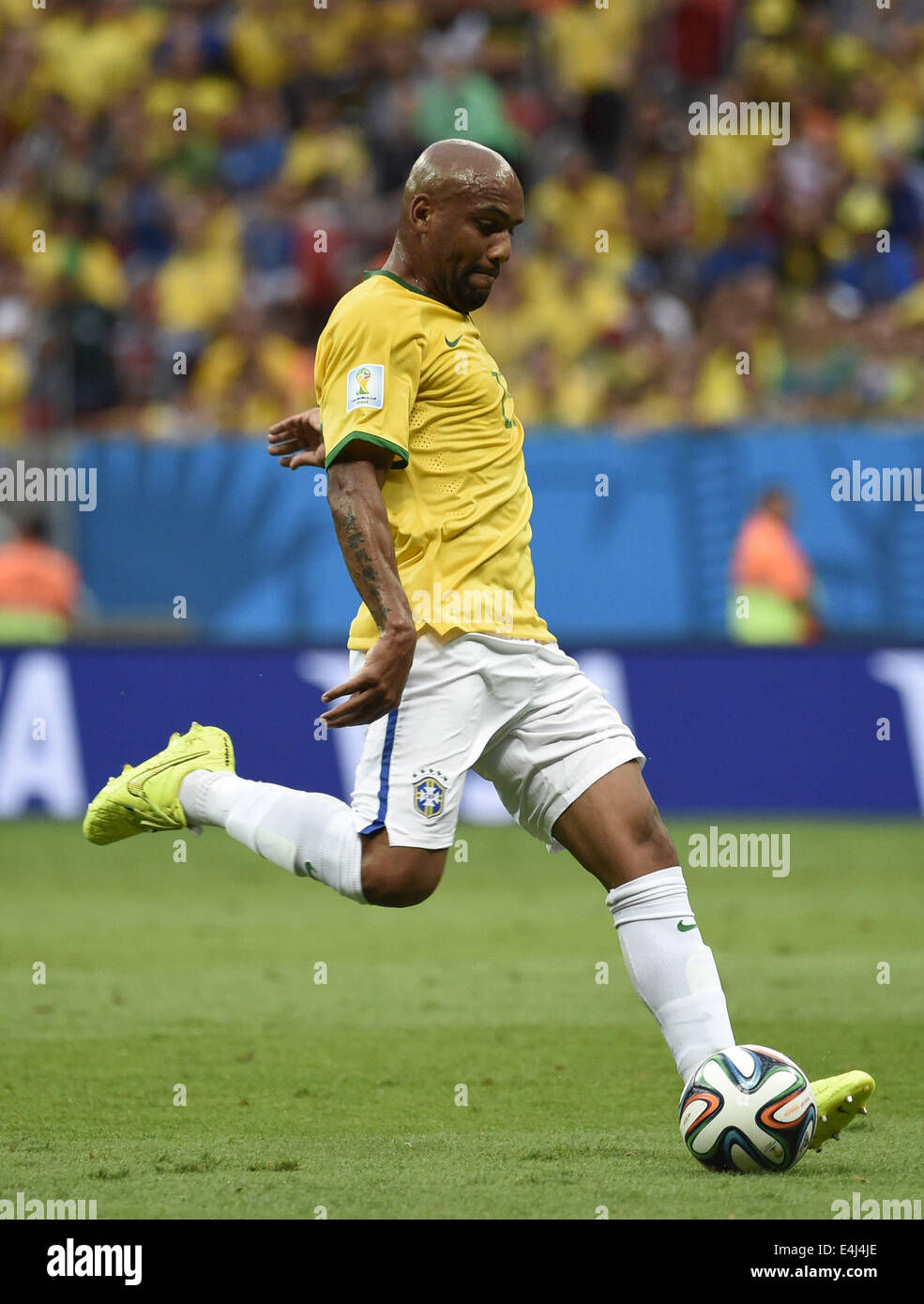 Brasilia, Brazil. 12th July, 2014. Brazil's Maicon passes the ball during the third place play-off match between Brazil and Netherlands of 2014 FIFA World Cup at the Estadio Nacional Stadium in Brasilia, Brazil, on July 12, 2014. Credit:  Yang Lei/Xinhua/Alamy Live News Stock Photo