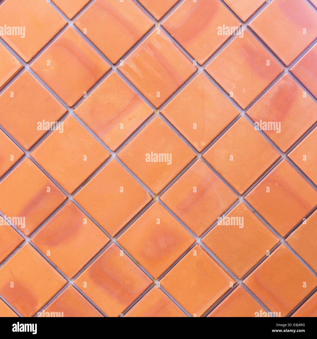 Brown wall tiles as a background or texture. Stock Photo