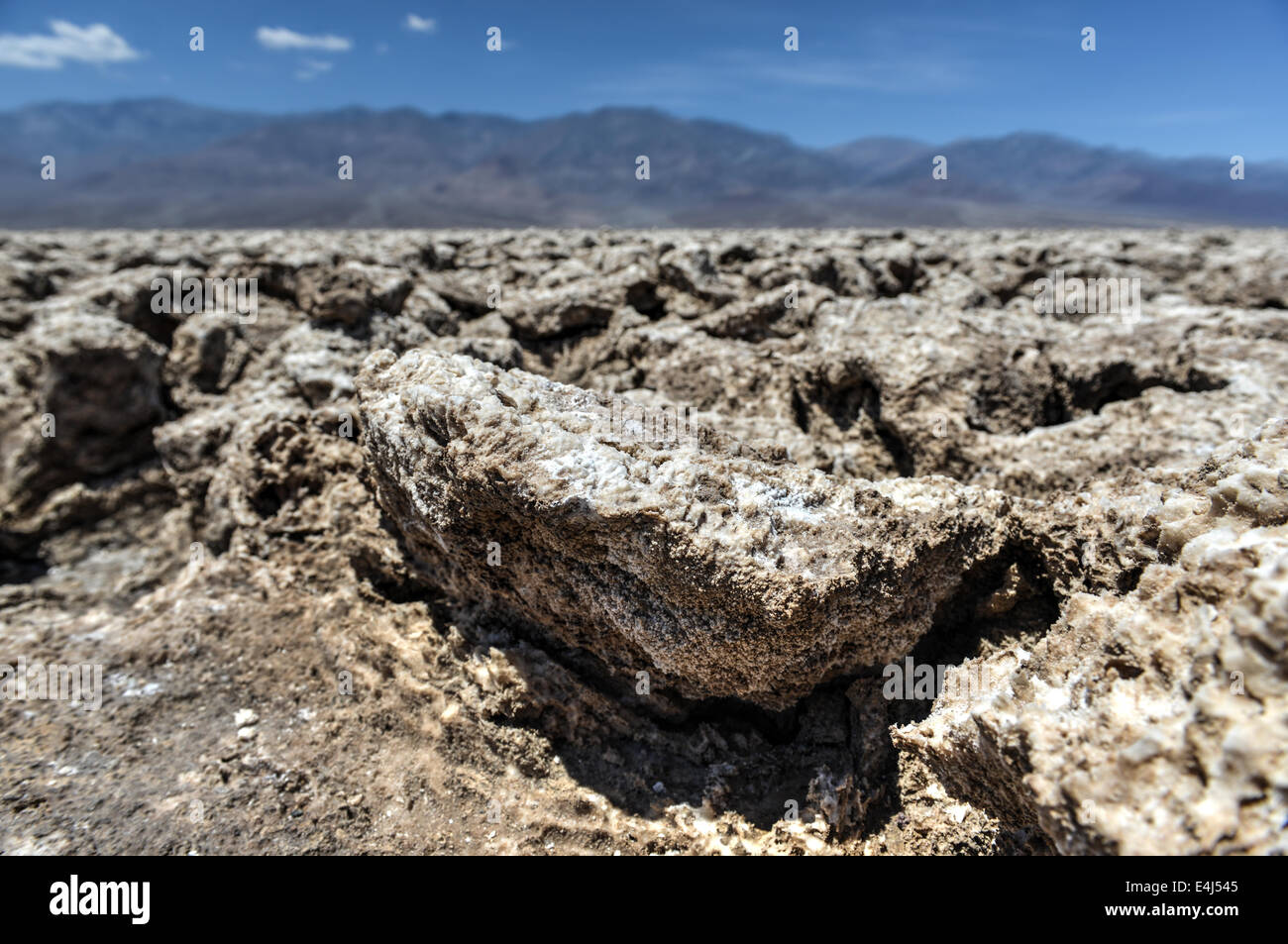 Close up of the rough ground and salt crystals which form the unusual geology of the Devil's Golf Course in Death Valley. Stock Photo