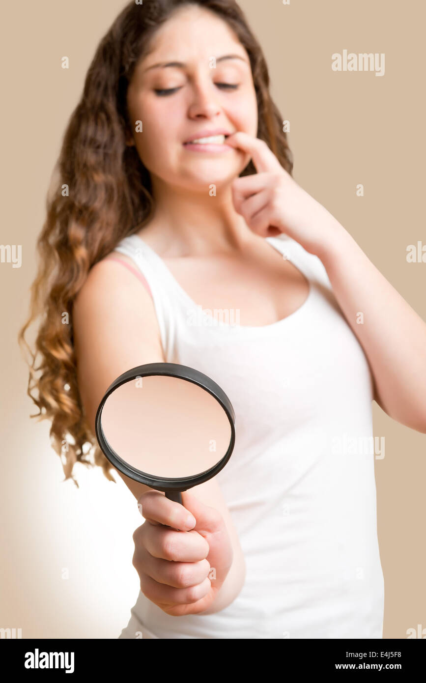 Concept of woman looking at a man with a small penis with a loupe Stock  Photo - Alamy