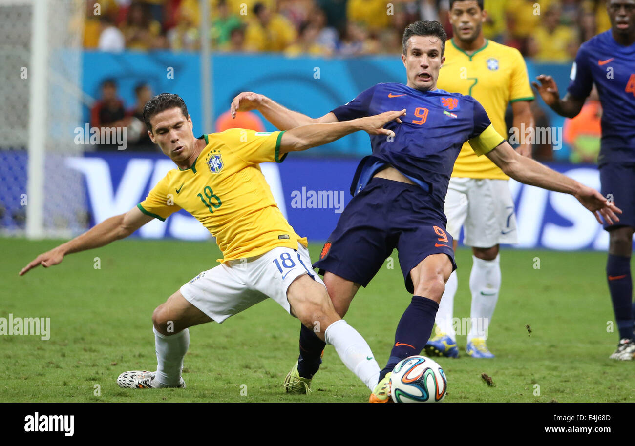 Brasilia, Brazil. 12th July, 2014. Netherlands' Robin van Persie vies with Brazil's Hernanes during the third place play-off match between Brazil and Netherlands of 2014 FIFA World Cup at the Estadio Nacional Stadium in Brasilia, Brazil, on July 12, 2014. Netherlands won 3-0 over Brazil and took the third place of the tournament on Saturday. Credit:  Cao Can/Xinhua/Alamy Live News Stock Photo