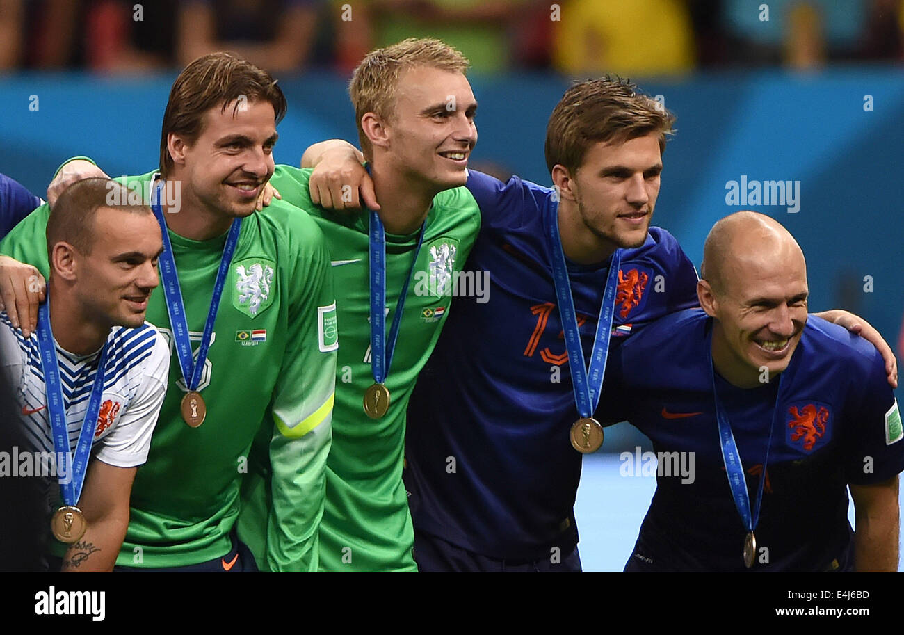 Brasilia, Brazil. 12th July, 2014. Netherlands' Wesley Sneijder, Tim Krul, Jasper Cillessen, Joel Veltman and Arjen Robben (L to R) pose with their medals after the third place play-off match between Brazil and Netherlands of 2014 FIFA World Cup at the Estadio Nacional Stadium in Brasilia, Brazil, on July 12, 2014. Netherlands won 3-0 over Brazil and took the third place of the tournament on Saturday. Credit:  Guo Yong/Xinhua/Alamy Live News Stock Photo