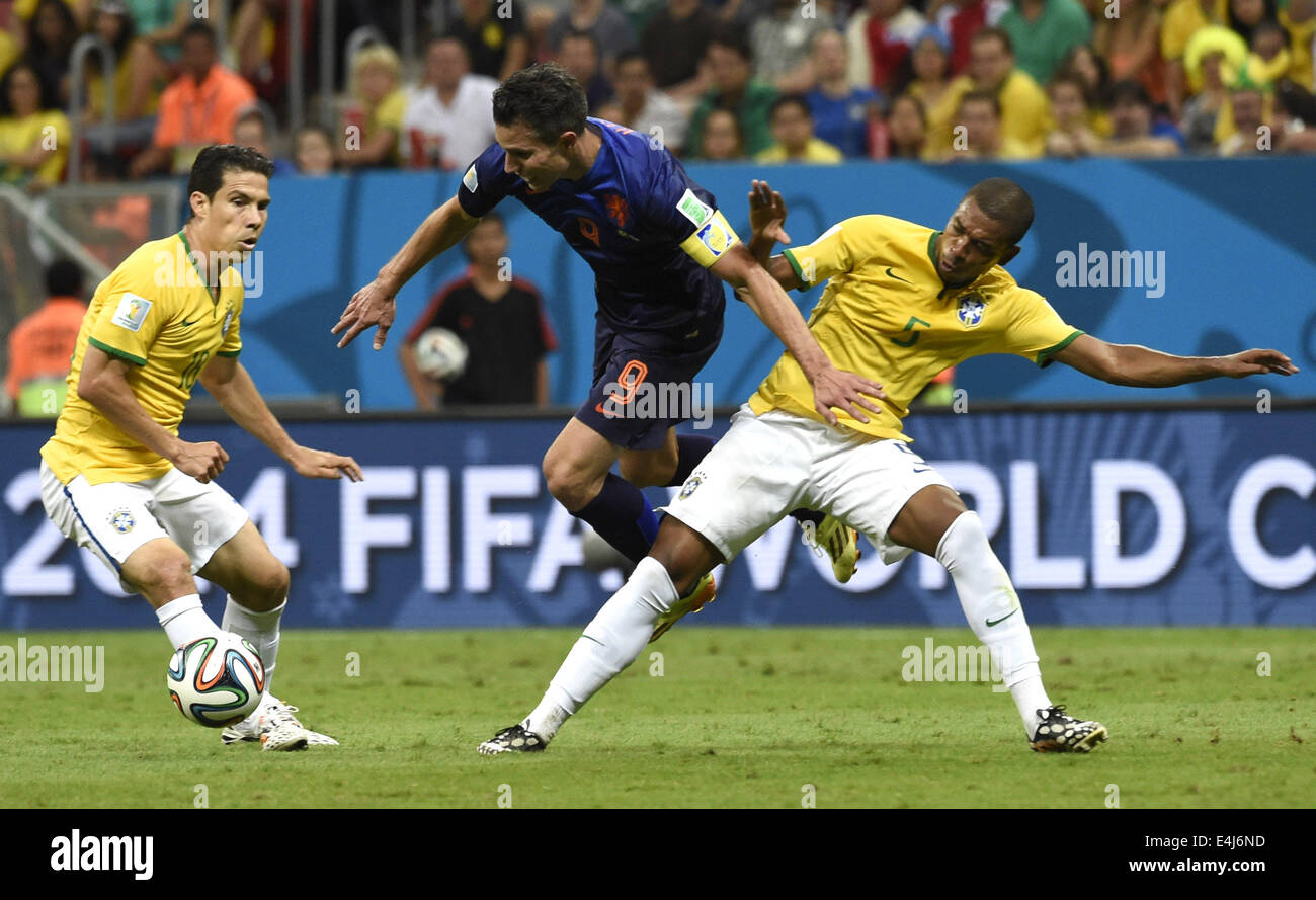 Brasilia, Brazil. 12th July, 2014. Netherlands' Robin van Persie (C) vies with Brazil's Fernandinho (R) and Hernanes during the third place play-off match between Brazil and Netherlands of 2014 FIFA World Cup at the Estadio Nacional Stadium in Brasilia, Brazil, on July 12, 2014. Netherlands won 3-0 over Brazil and took the third place of the tournament on Saturday. Credit:  Yang Lei/Xinhua/Alamy Live News Stock Photo