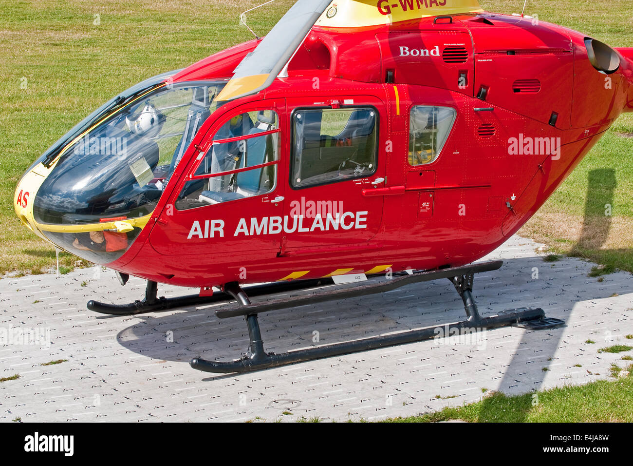 One of the three North West Air Ambulance Eurocopter EC-13 helicopters on  the ready pad at its base at Manchester City Airport Stock Photo - Alamy
