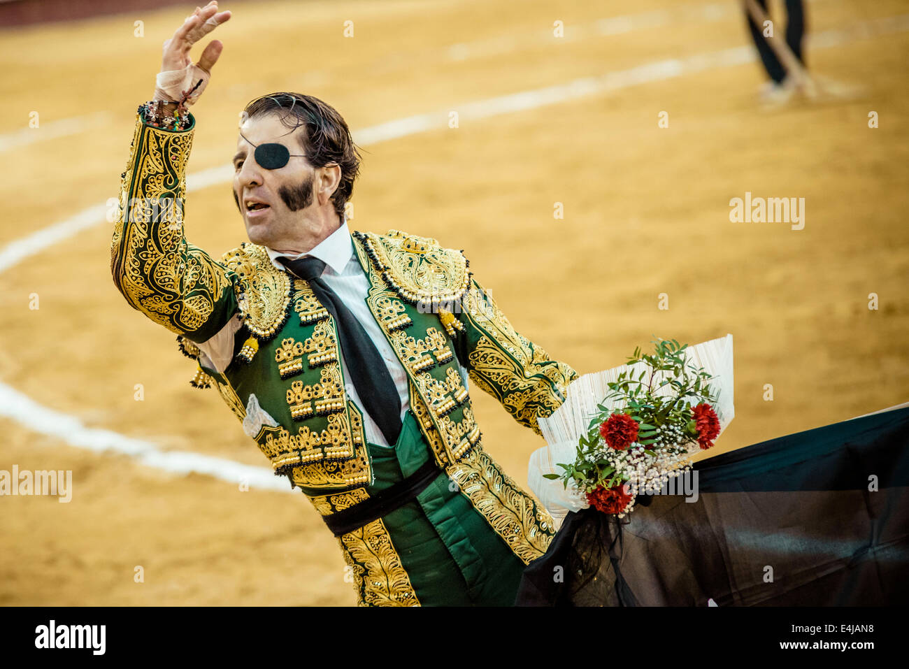 Spanish bullfighter JUAN JOSE PADILLA celebrates the end of a bullfight at the Plaza Toros de Valencia bullring during the Fallas Festival 2014 - A couple of thousand spectators gave Juan Jose Padilla a hero's welcome in the Plaza de Toros of Valencia during the Fallas Festival. Padilla wears an eyepatch - gaining the nickname 'The Pirate' - since he was badly injured by a bull in 2011. Stock Photo