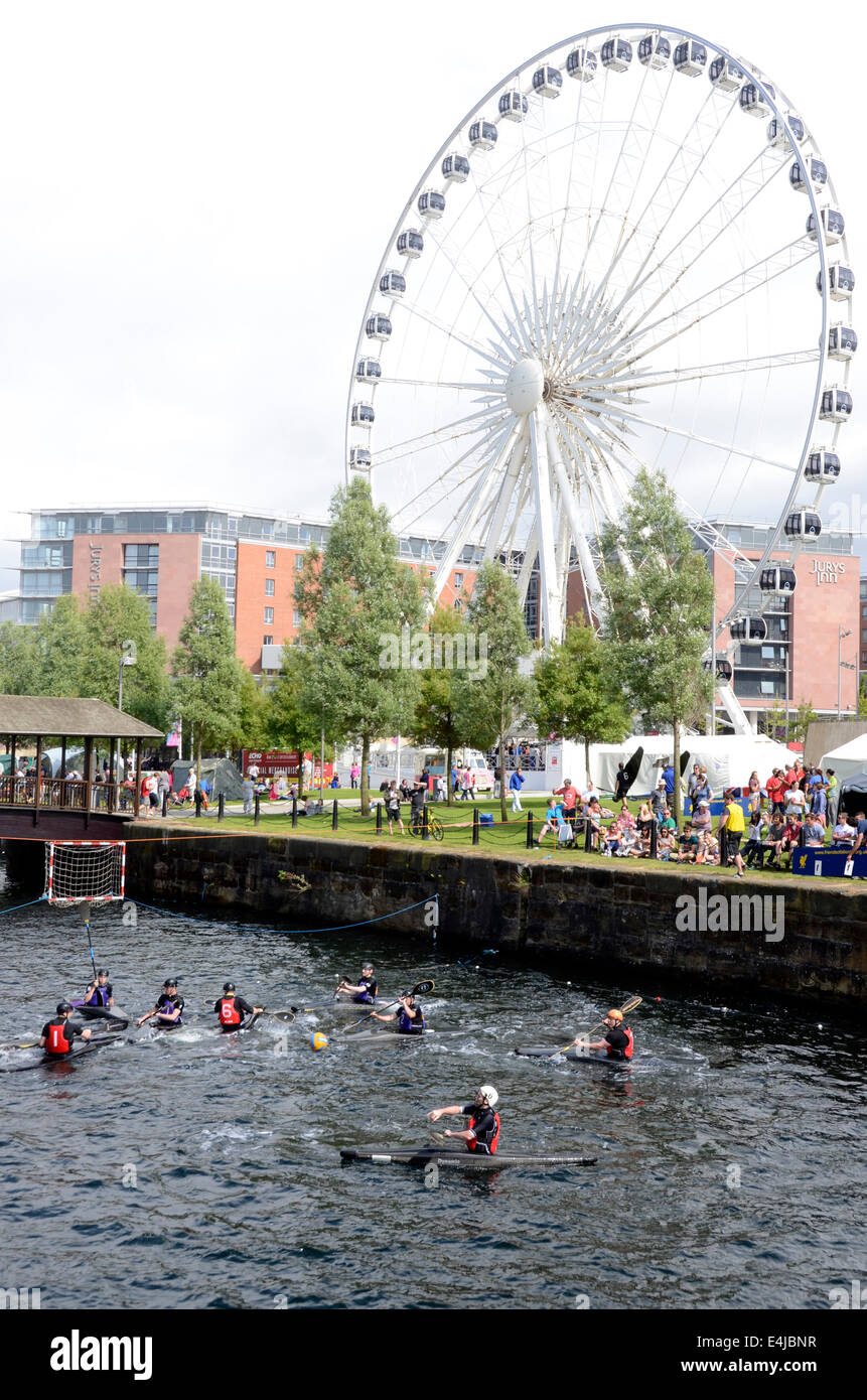 Canoe polo being played by the Liverpool Eye 360 in the Albert Dock, Liverpool, England UK Stock
