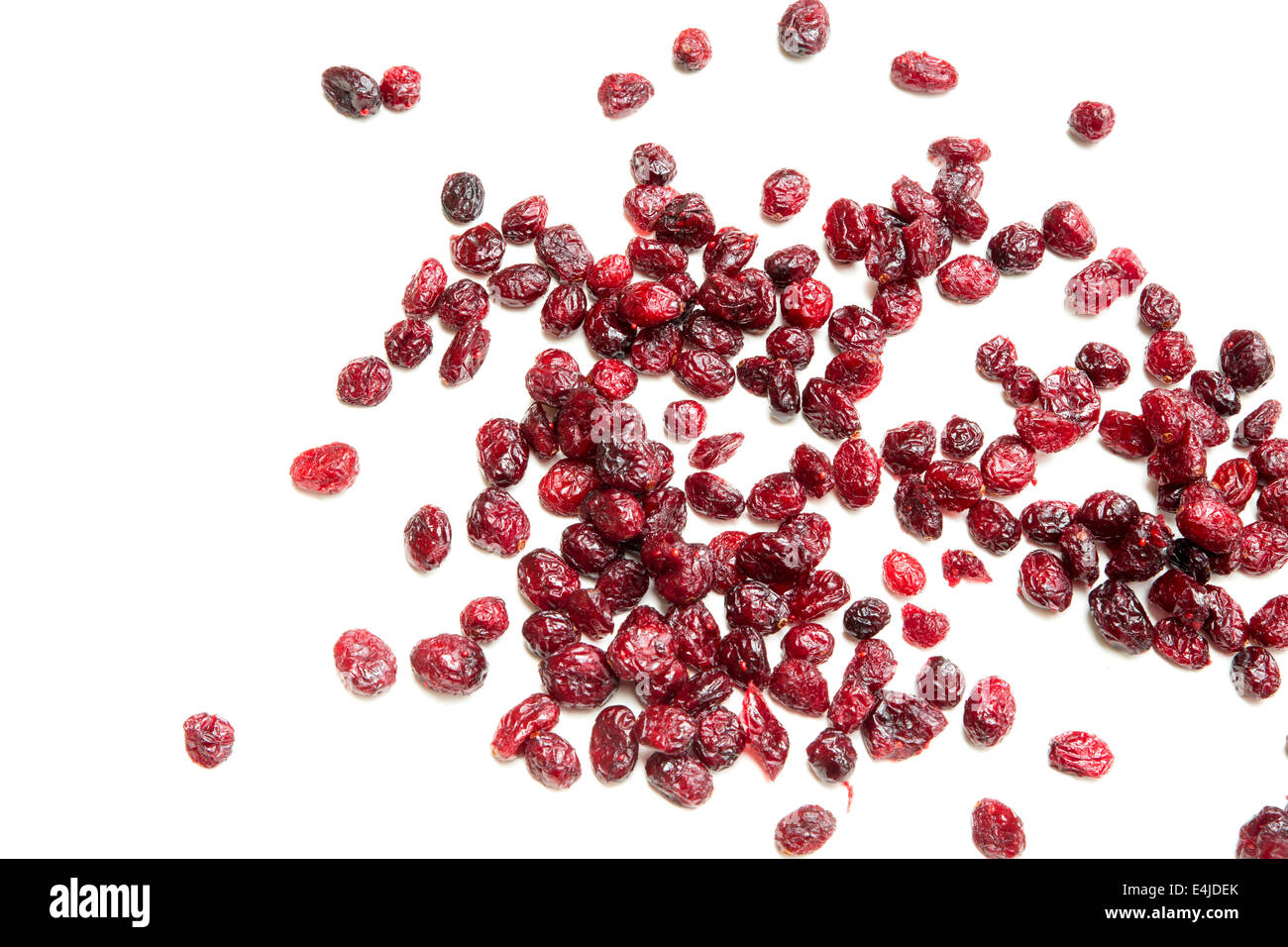Some dried cranberries isolated on white Stock Photo Alamy